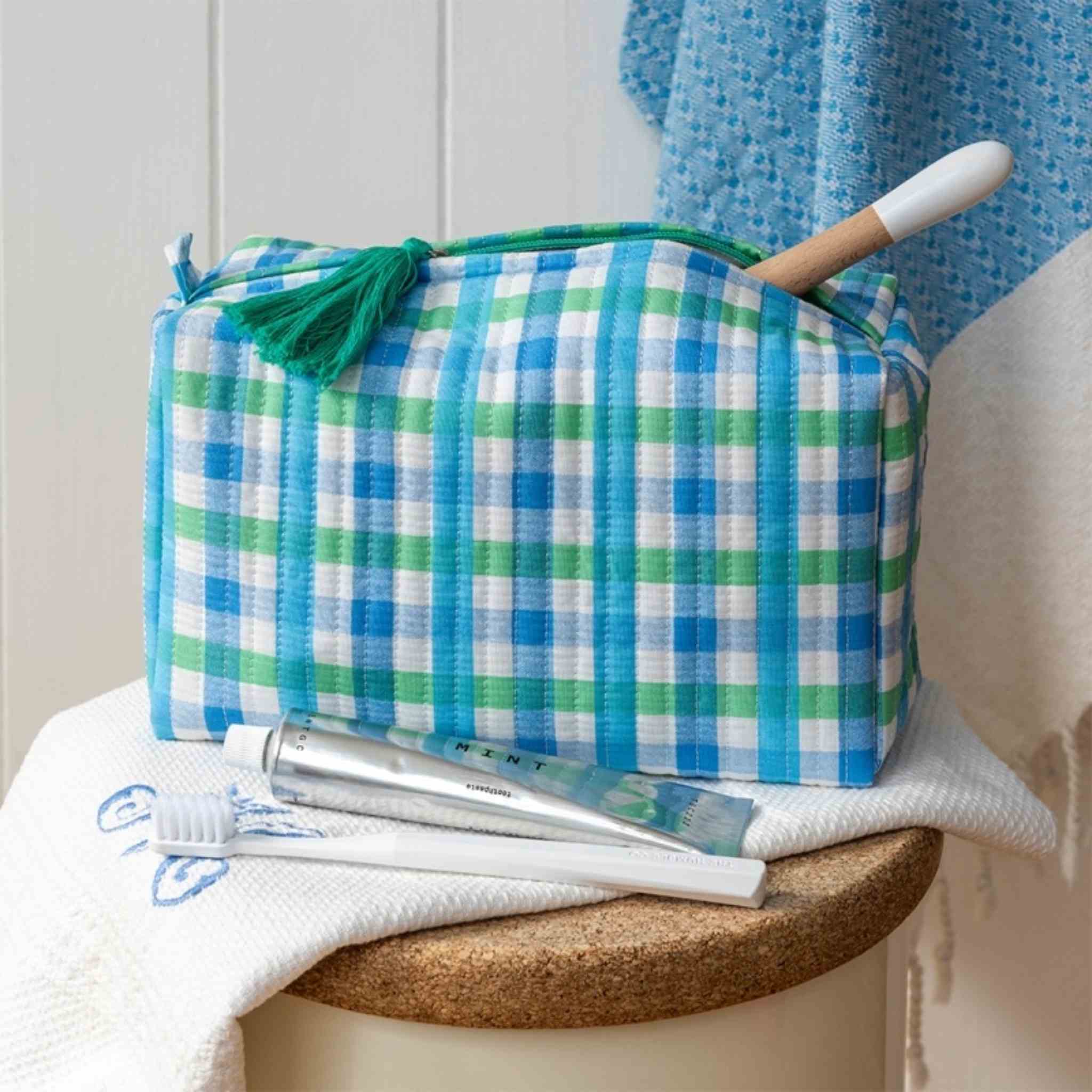 Blue Gingham Quilted Wash Bag in bathroom