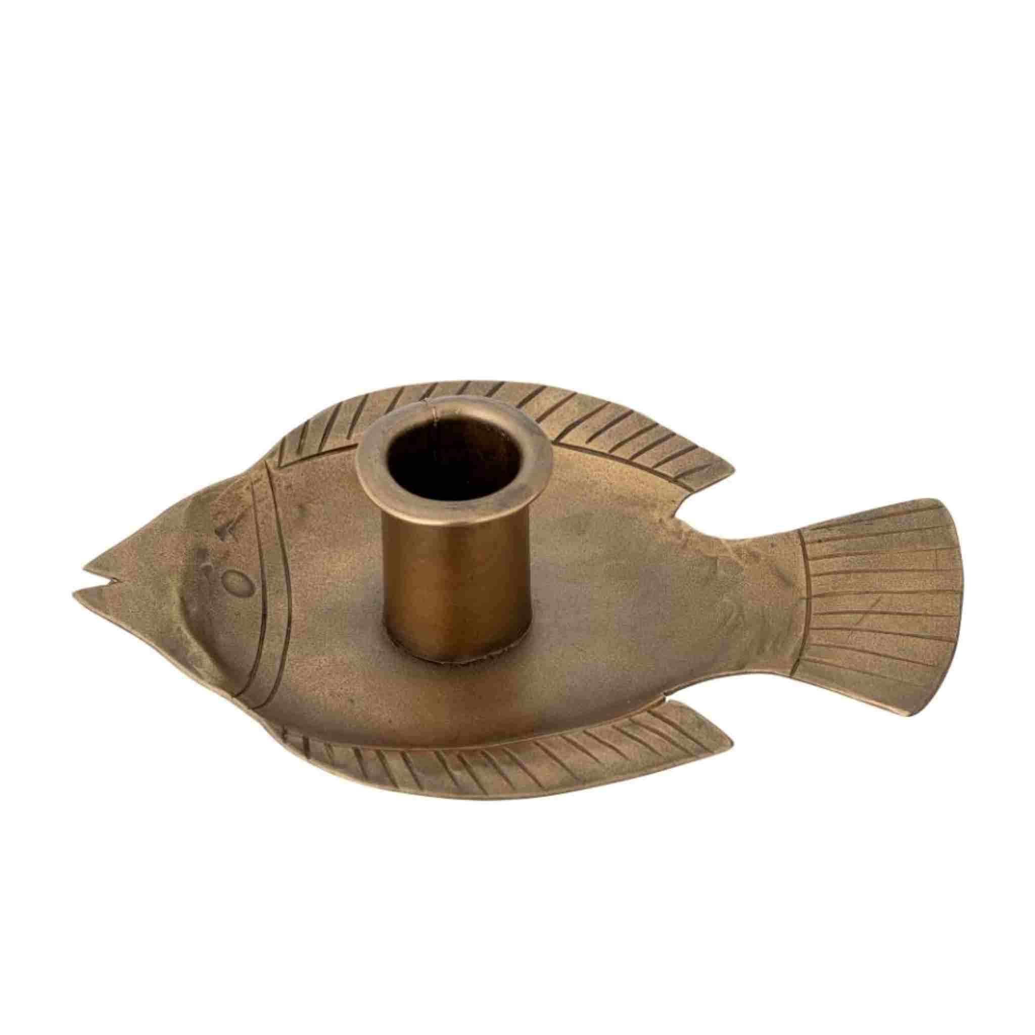 Bronze fish-shaped candle holder on a white background