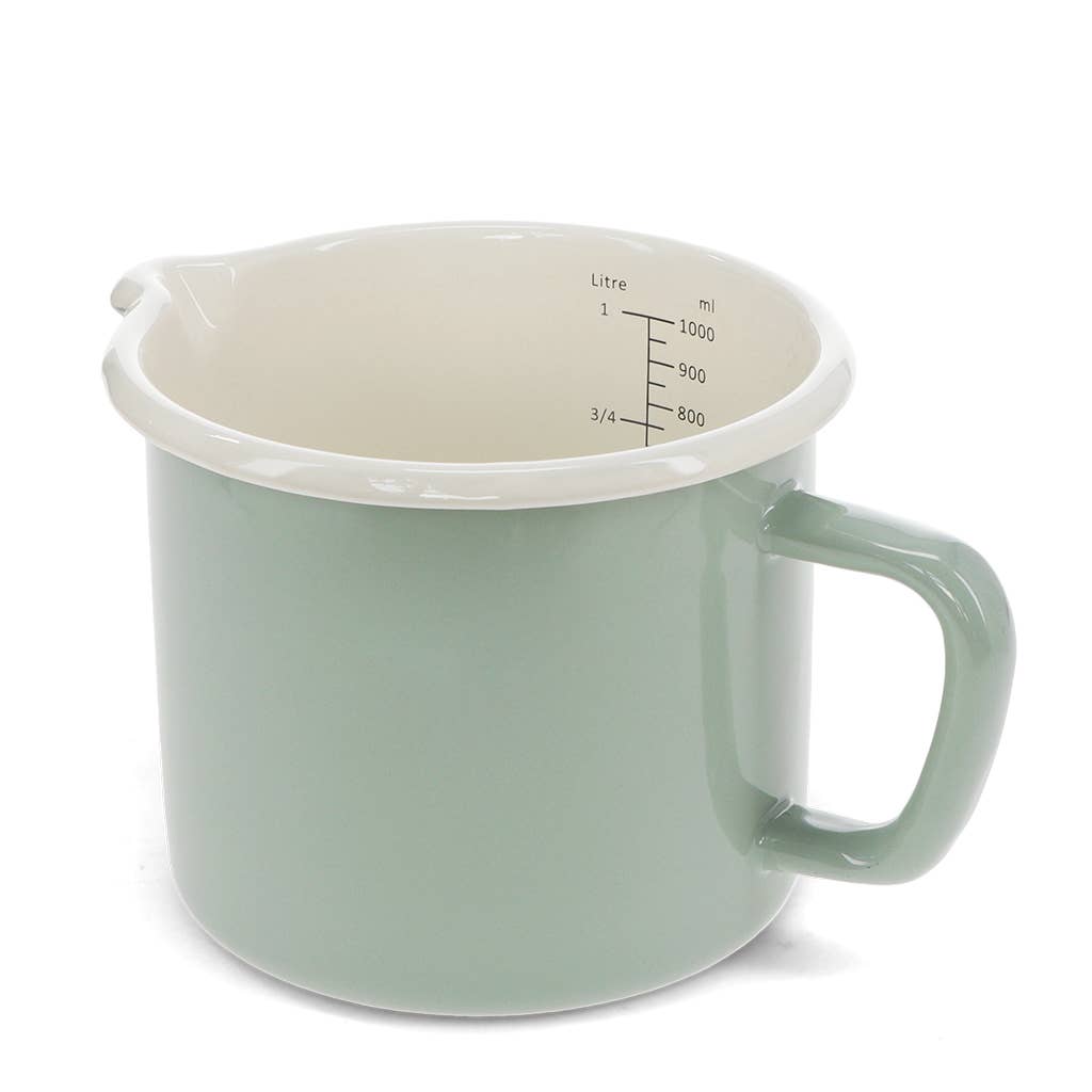 A light sage green enamel mug with a cream-colored interior and printed measurement markings in liters and milliliters, shown on a white background.