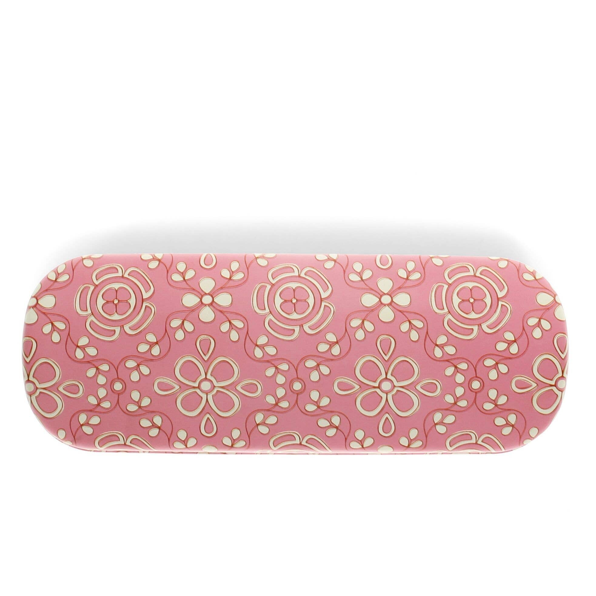 Pink cylindrical object with floral pattern on a white background