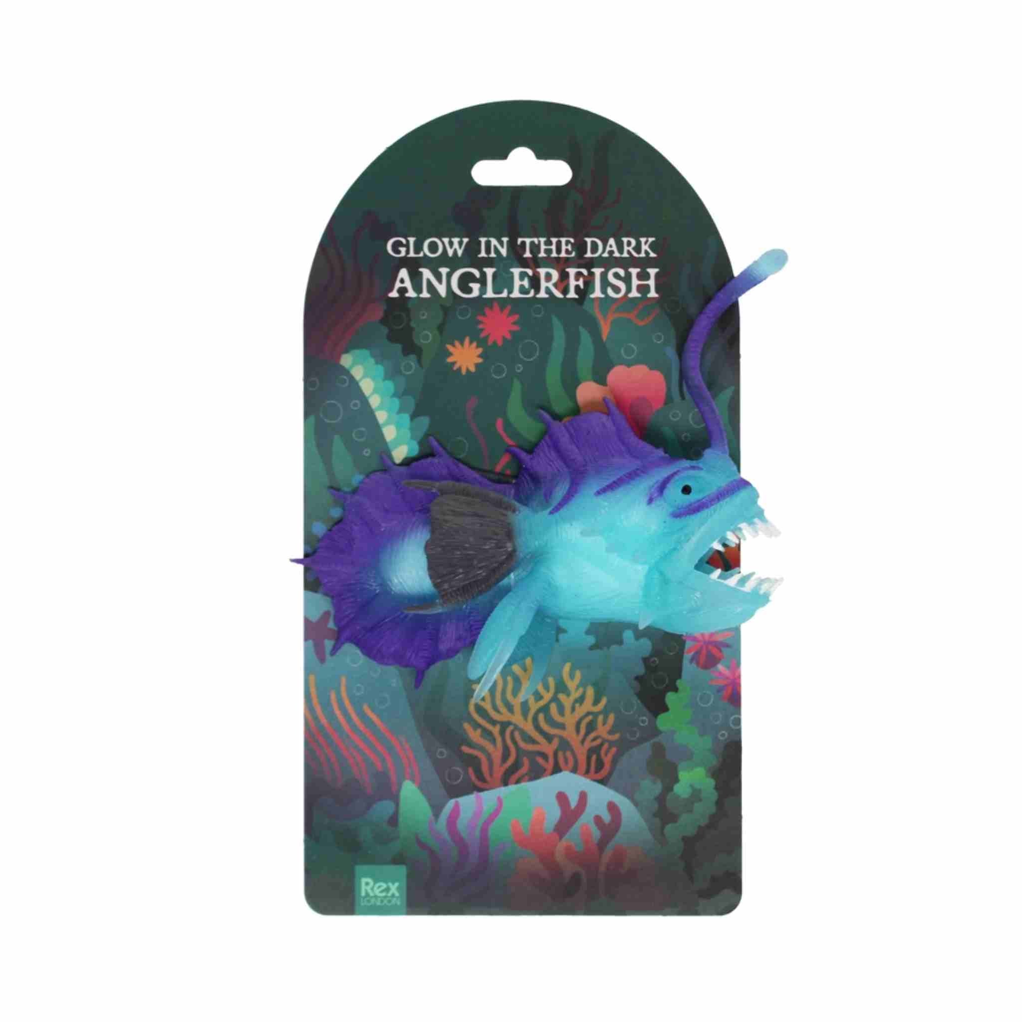 Glow-in-the-dark anglerfish toy with colorful packaging on a white background