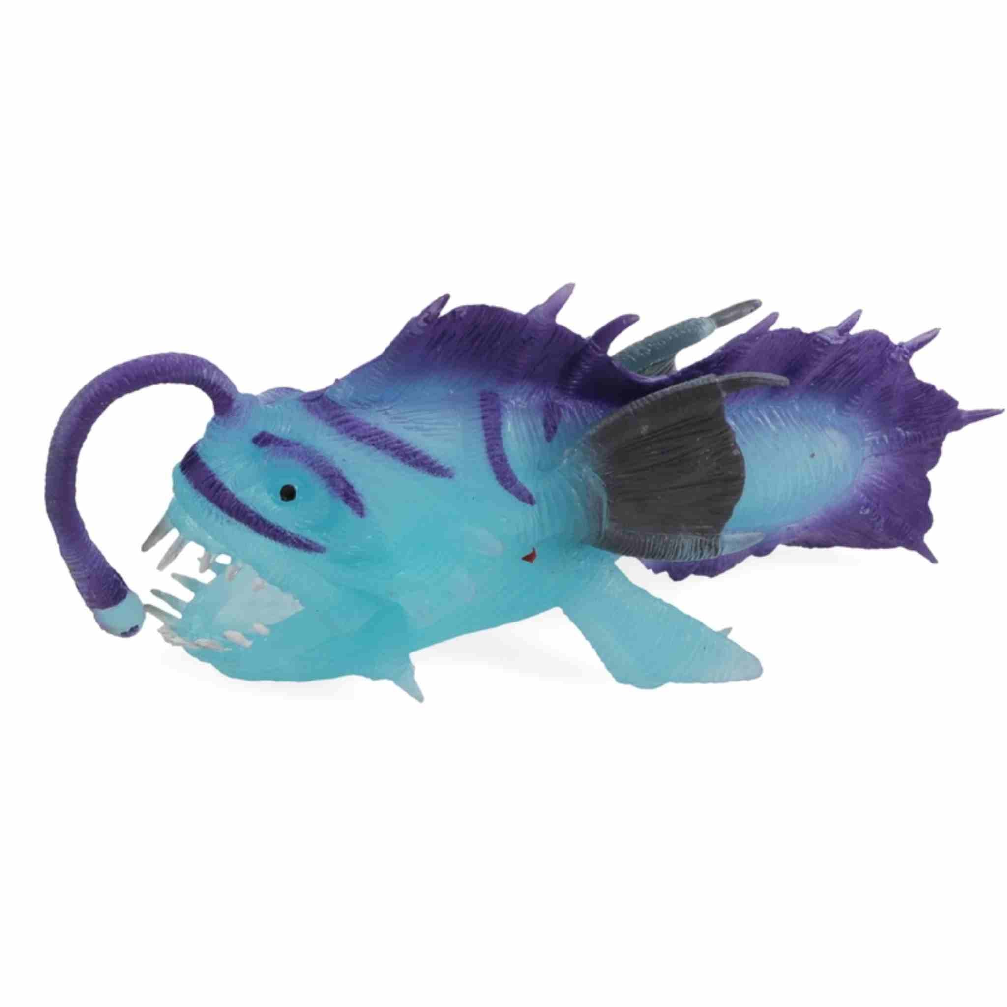 Blue and purple fish-shaped toy on a white background