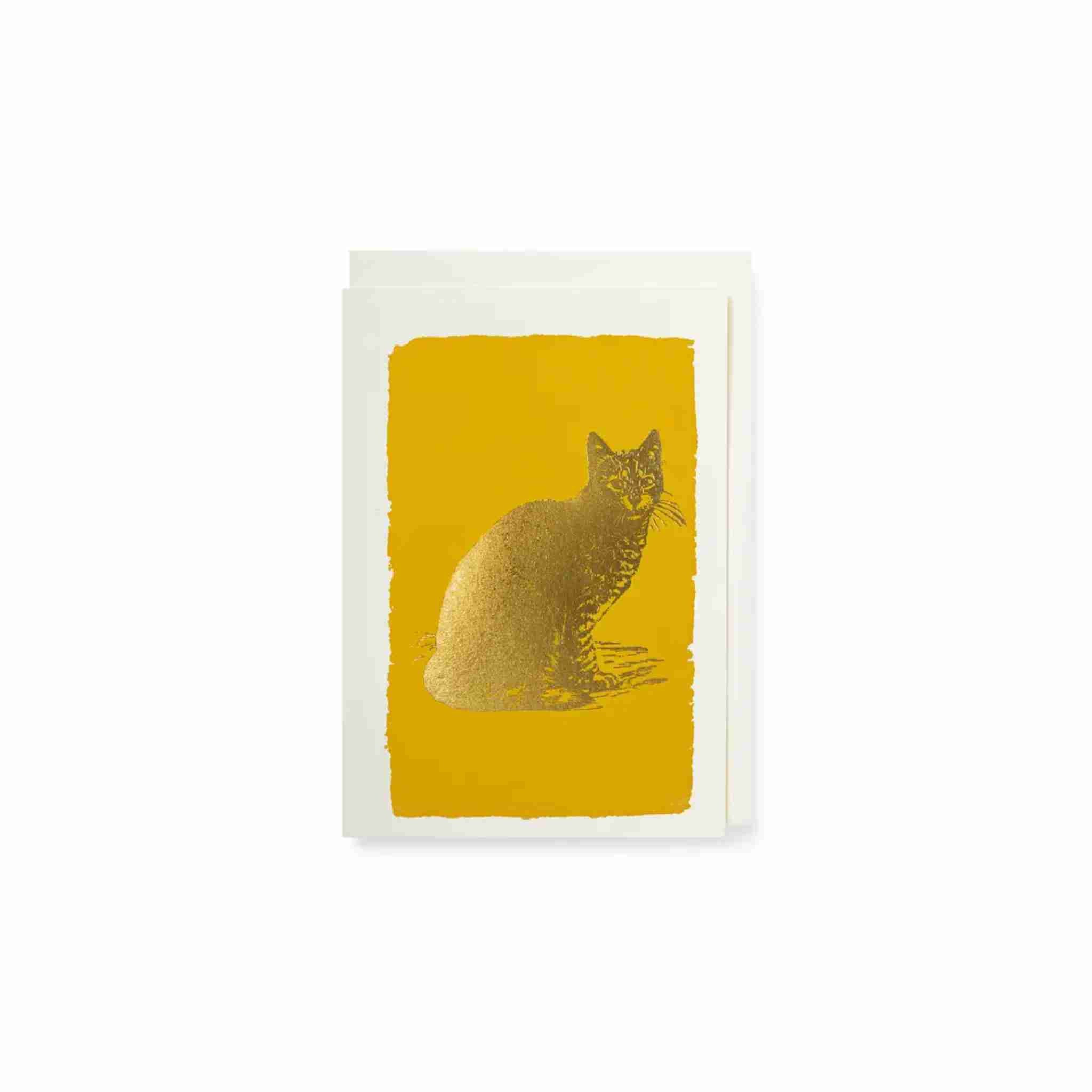 Greeting card with a gold cat illustration on a yellow background