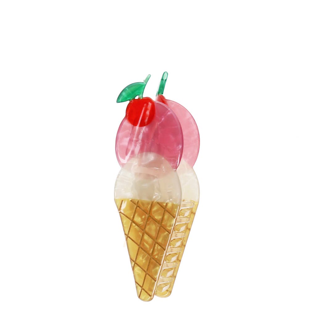 Ice cream cone with pink cherry on top against a white background