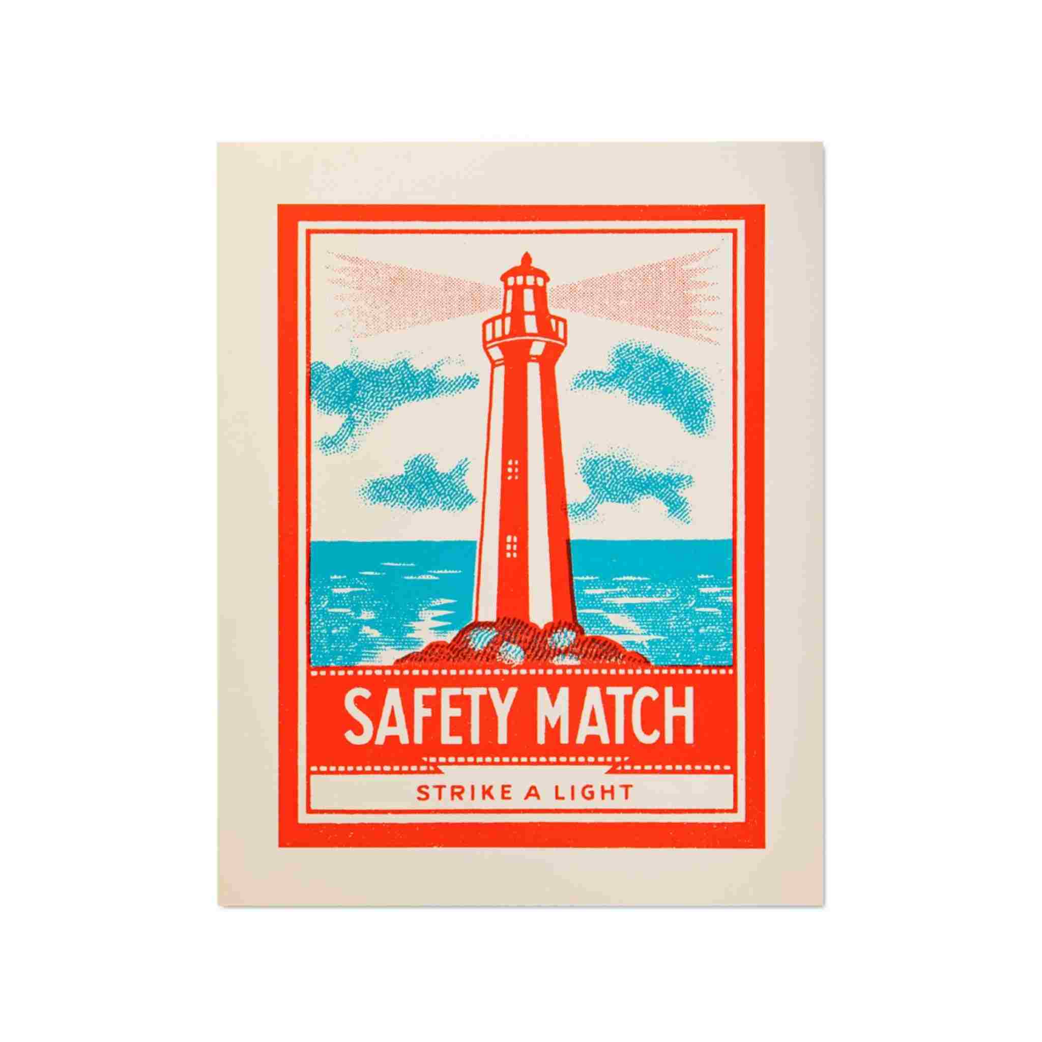 Safety match box with a lighthouse design on a white background