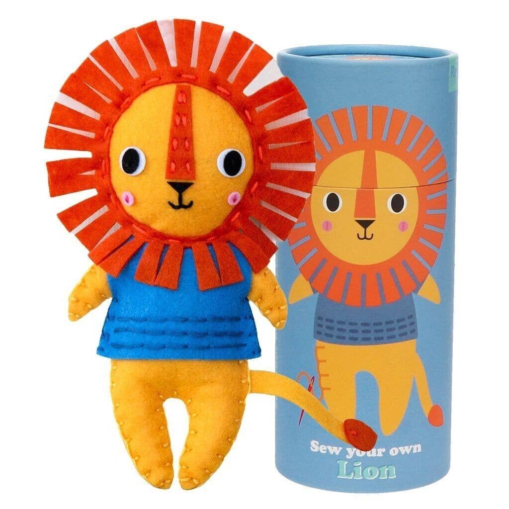 Plush lion toy with a blue body and orange mane, next to a cylindrical packaging with the same design.