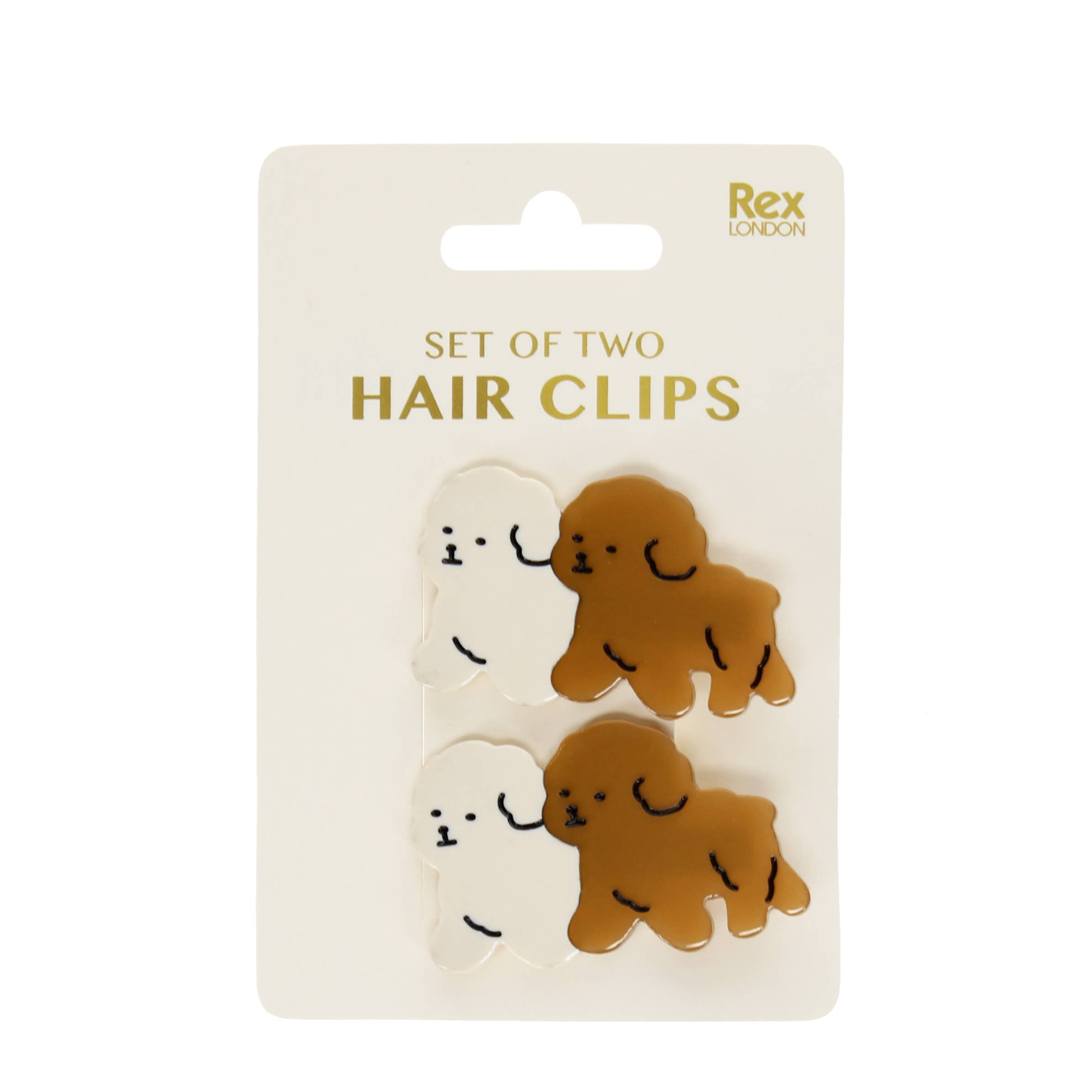Set of two hair clips with white and brown dog design clipped onto white packaging board