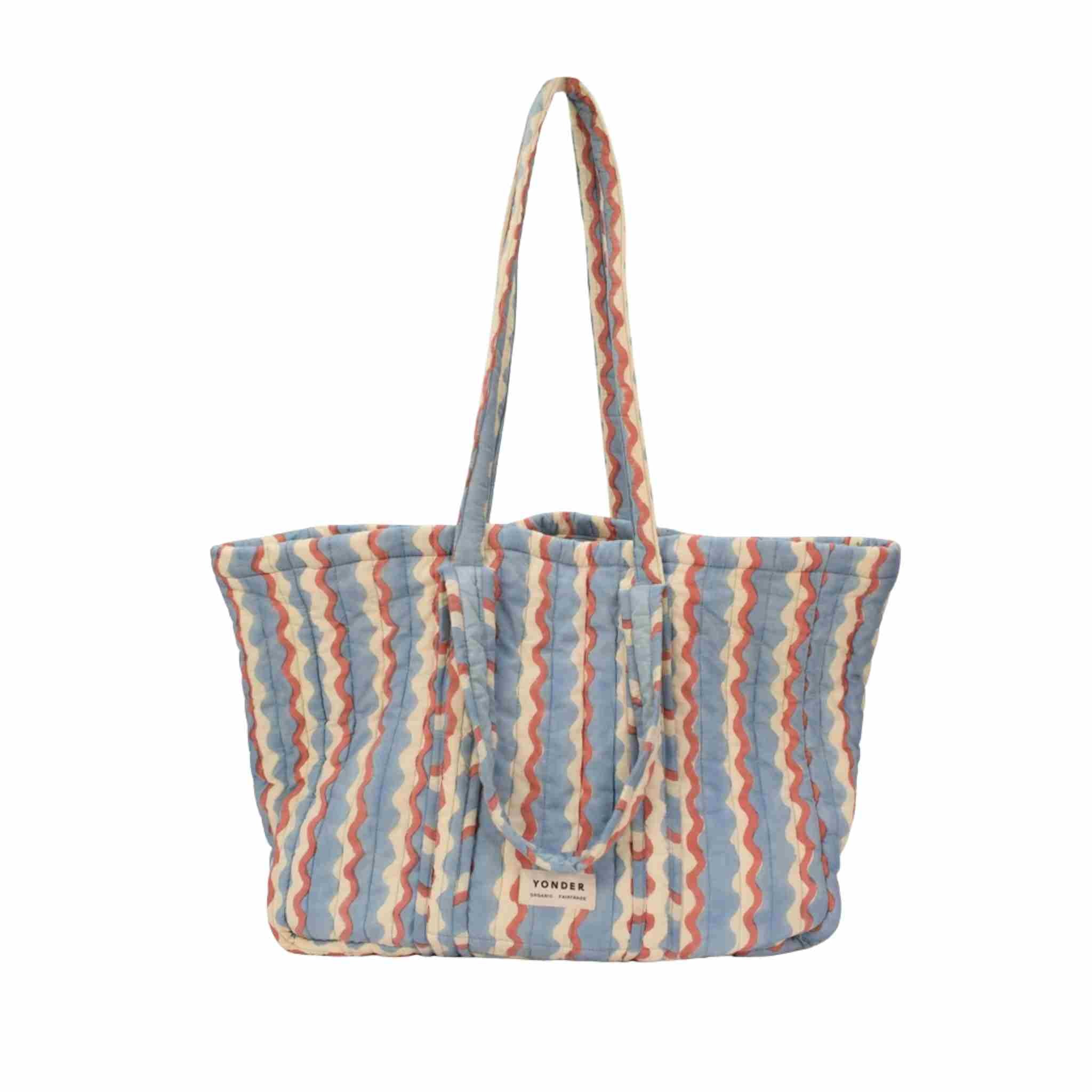 Striped tote bag with a visible brand logo on a white background