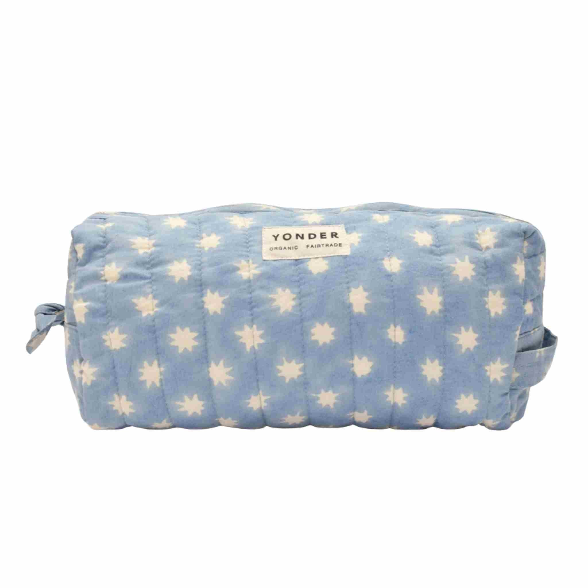 Blue pouch with white star pattern and 'Yonder' branding on a white background