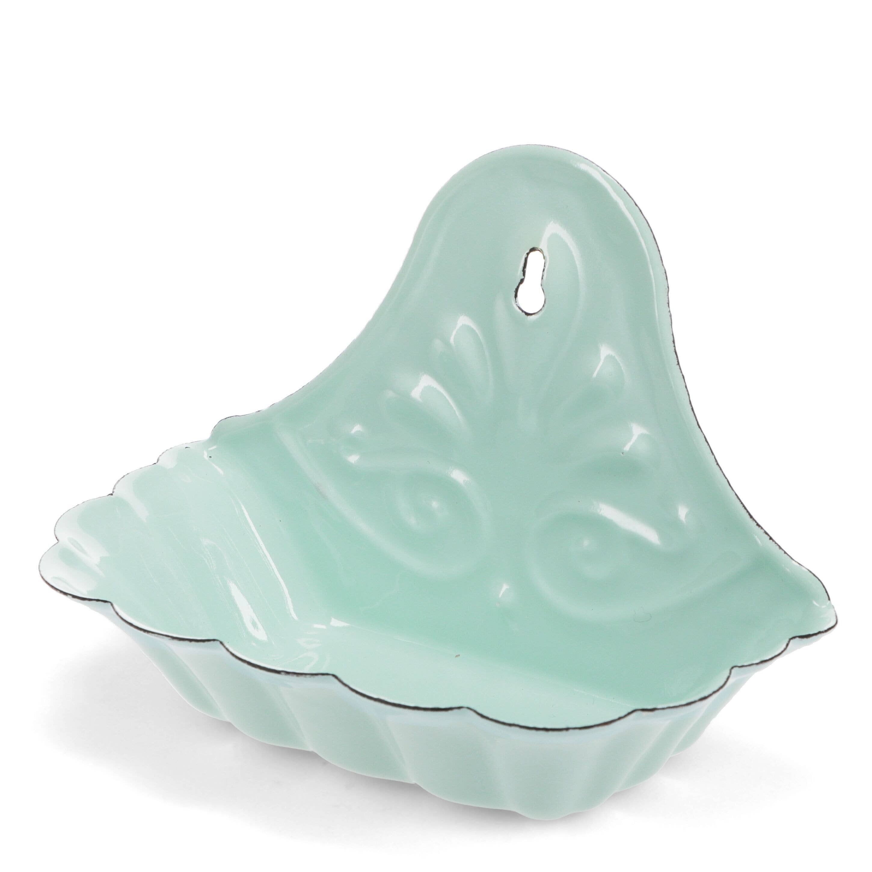 Light green ceramic dish shaped like a leaf on a white background