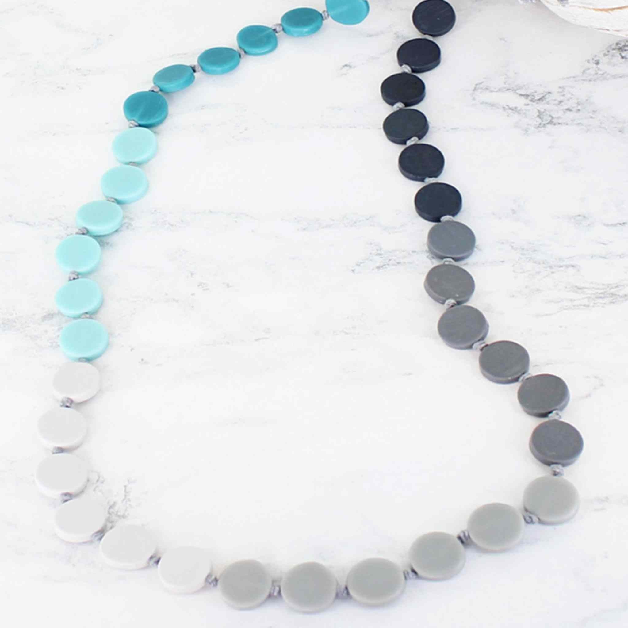 long blue tonal disc necklace