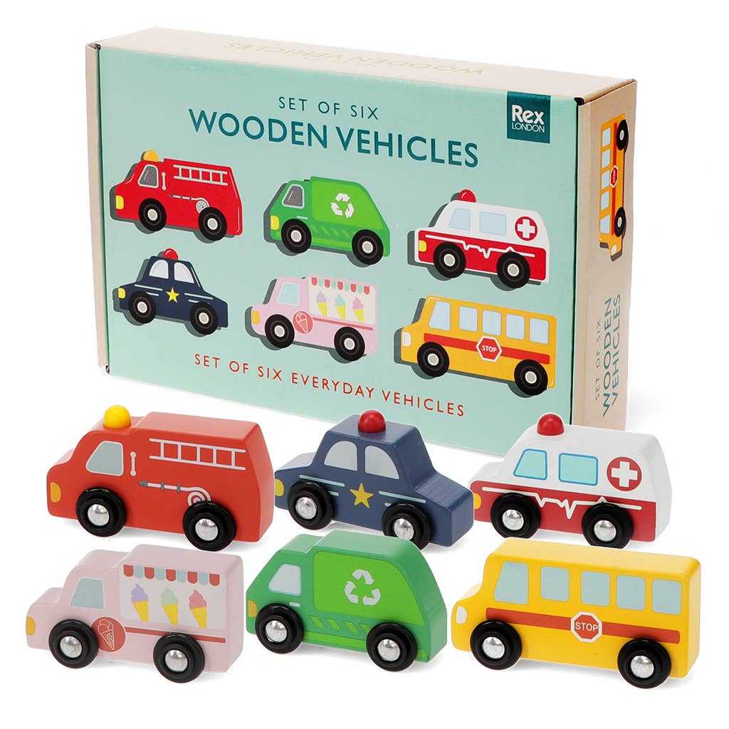 A set of six wooden toy vehicles in front of their mint green packaging box. 