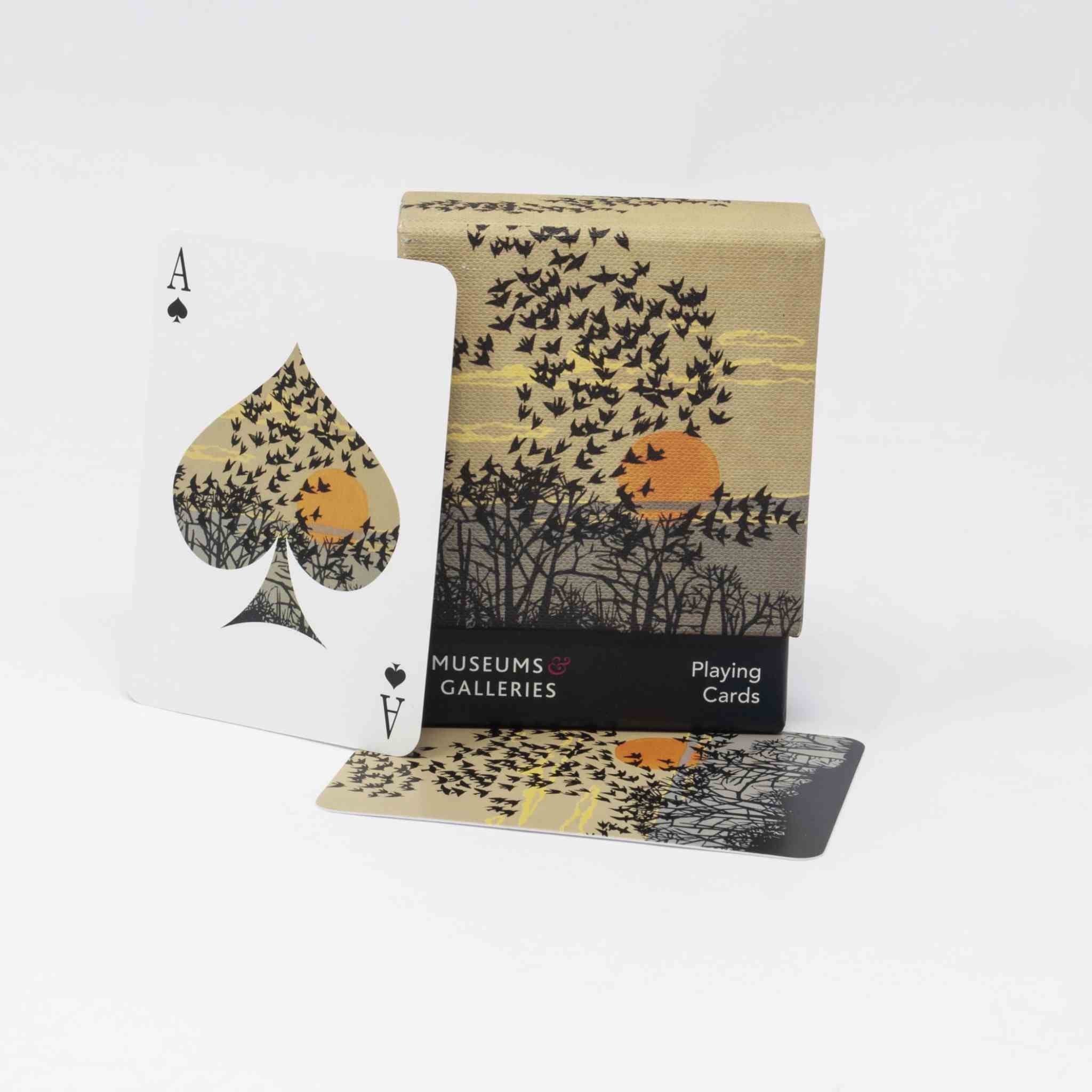 Playing cards with a design of birds flying over trees, featuring the Museums & Galleries logo.