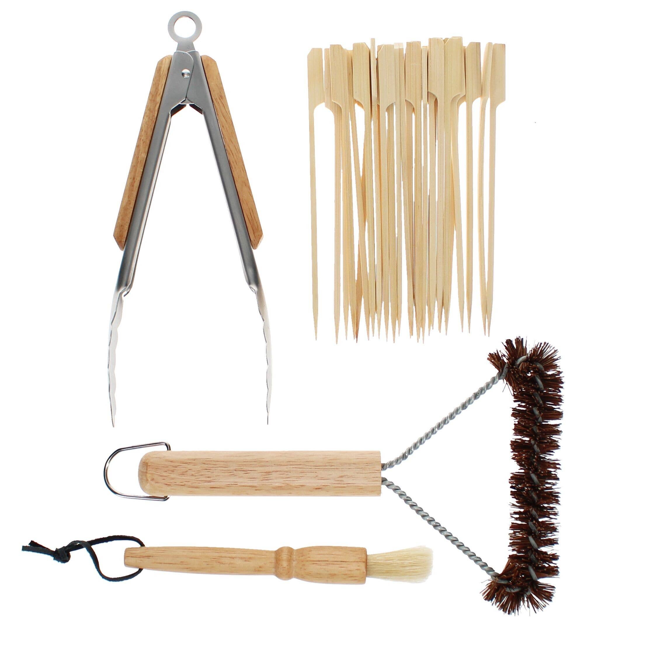 Barbecue tool set with tongs, skewers, brush, and cleaning tool on a white background