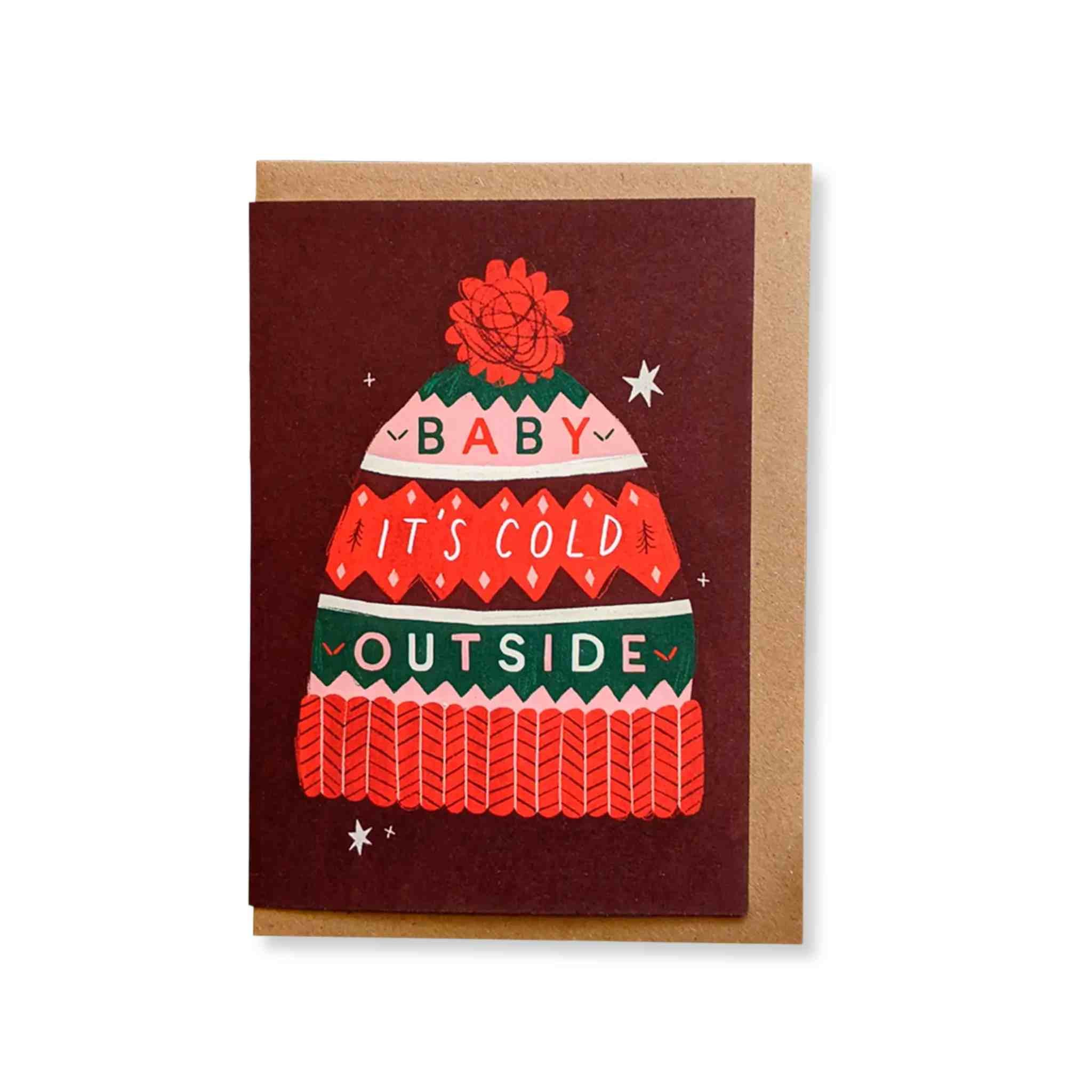 Greeting card with a winter hat illustration and text Baby Its Cold Outside 