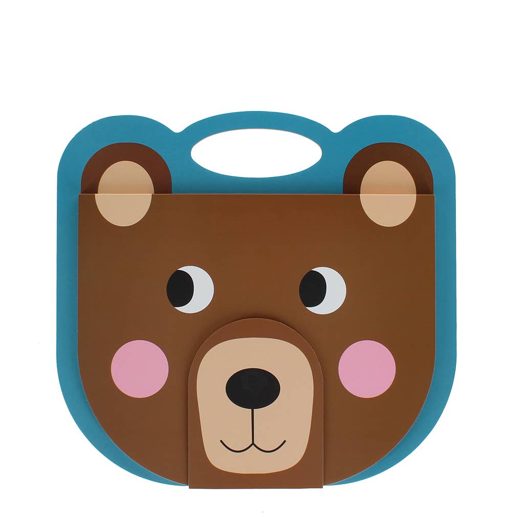 A children's book or toy with a bear face design, featuring a brown bear face with pink cheeks, black eyes, and a blue border on a white background.