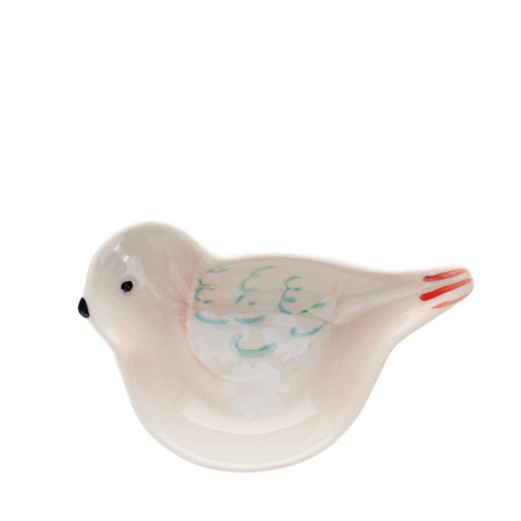 Ceramic dove figurine on a white background