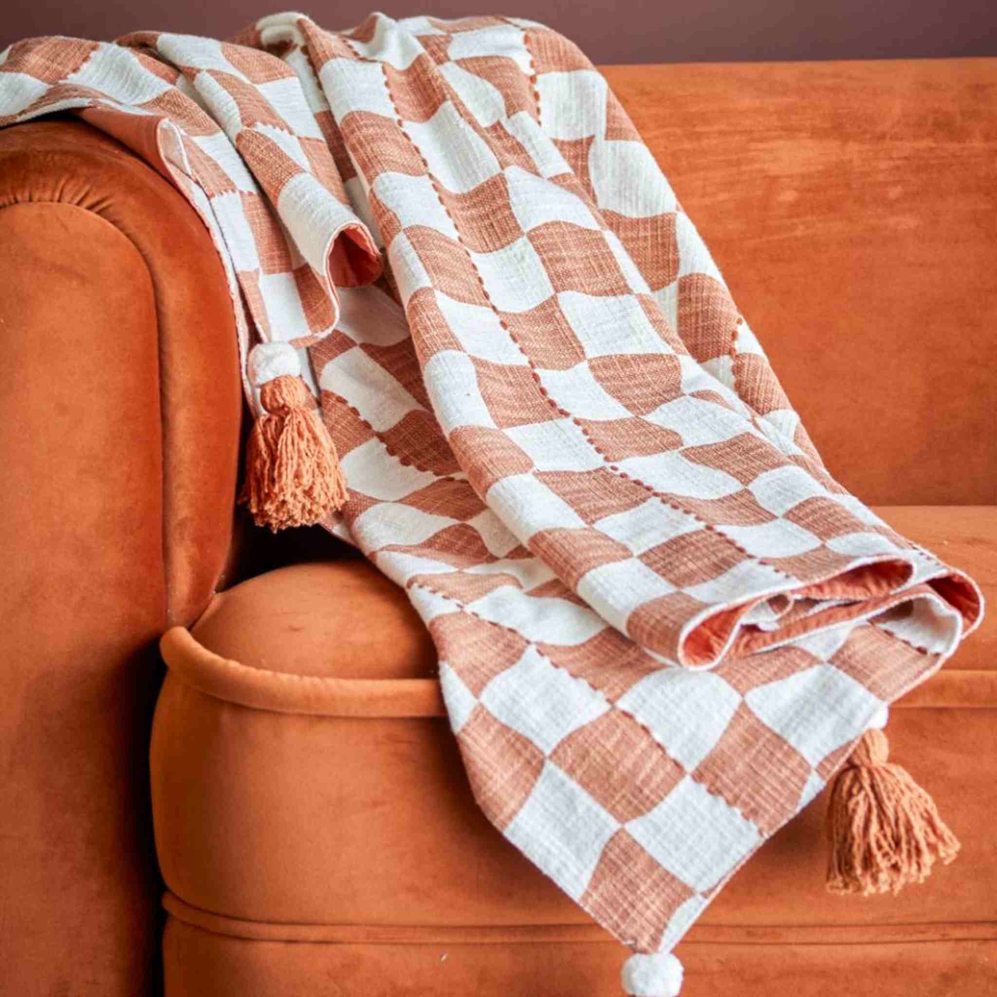 Brown & White over orange sofa