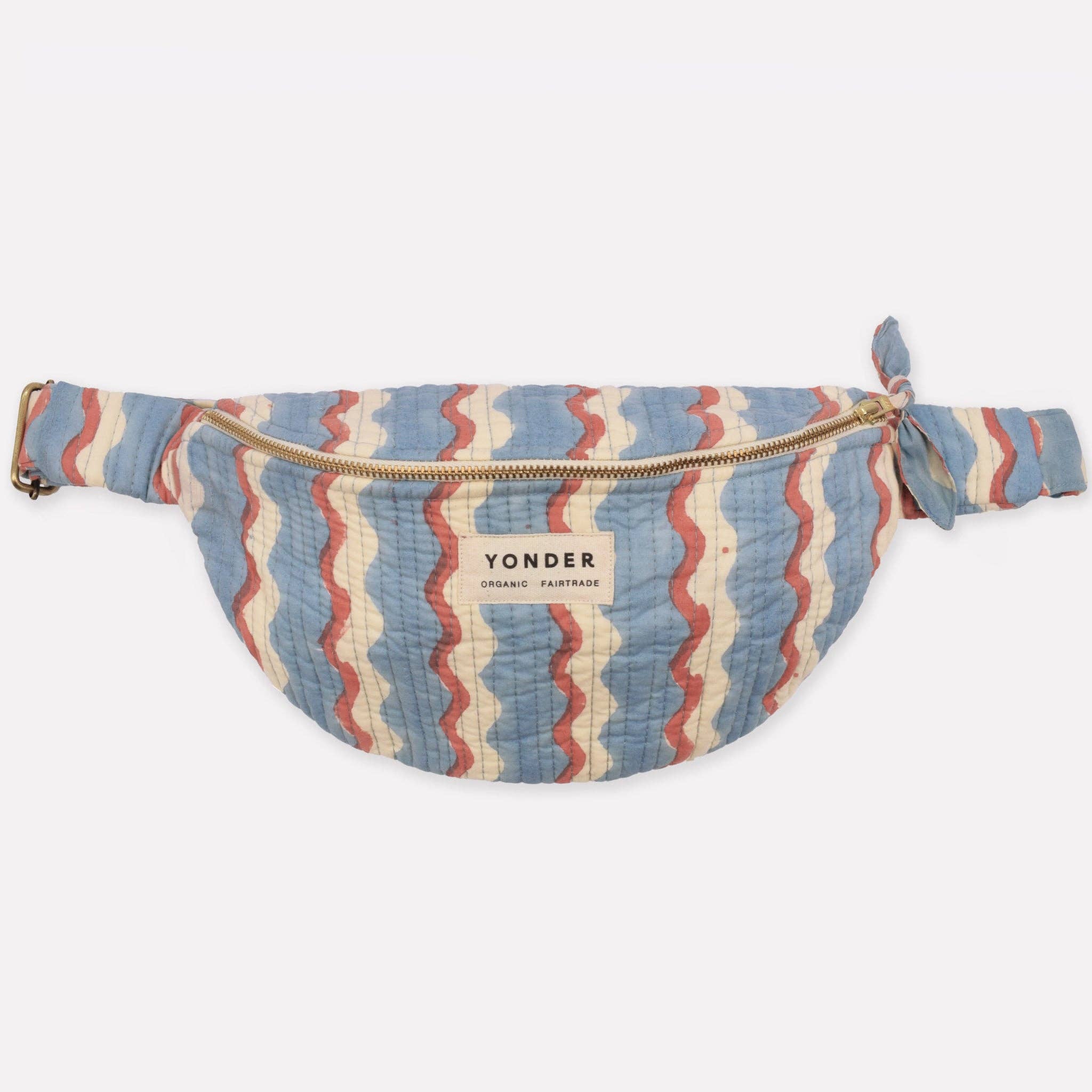 Striped fanny pack with 'Yonder' branding on a white background