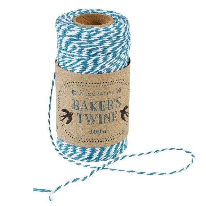 Roll of blue and white Baker's Twine with a cardboard tube packaging on a white background