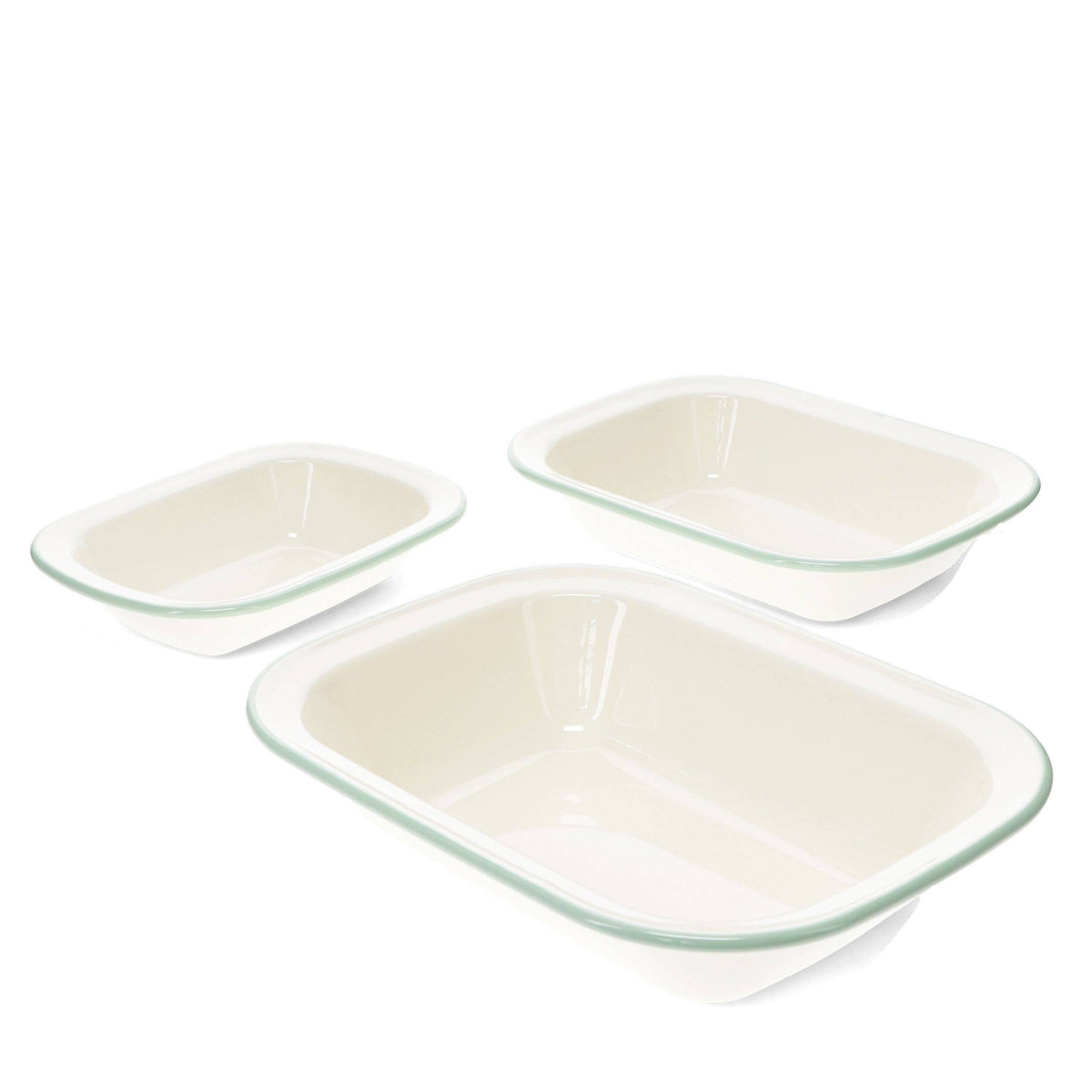 Three rectangular ceramic baking dishes in different sizes, featuring a glossy off-white interior and a thin mint green rim, set against a plain white background.