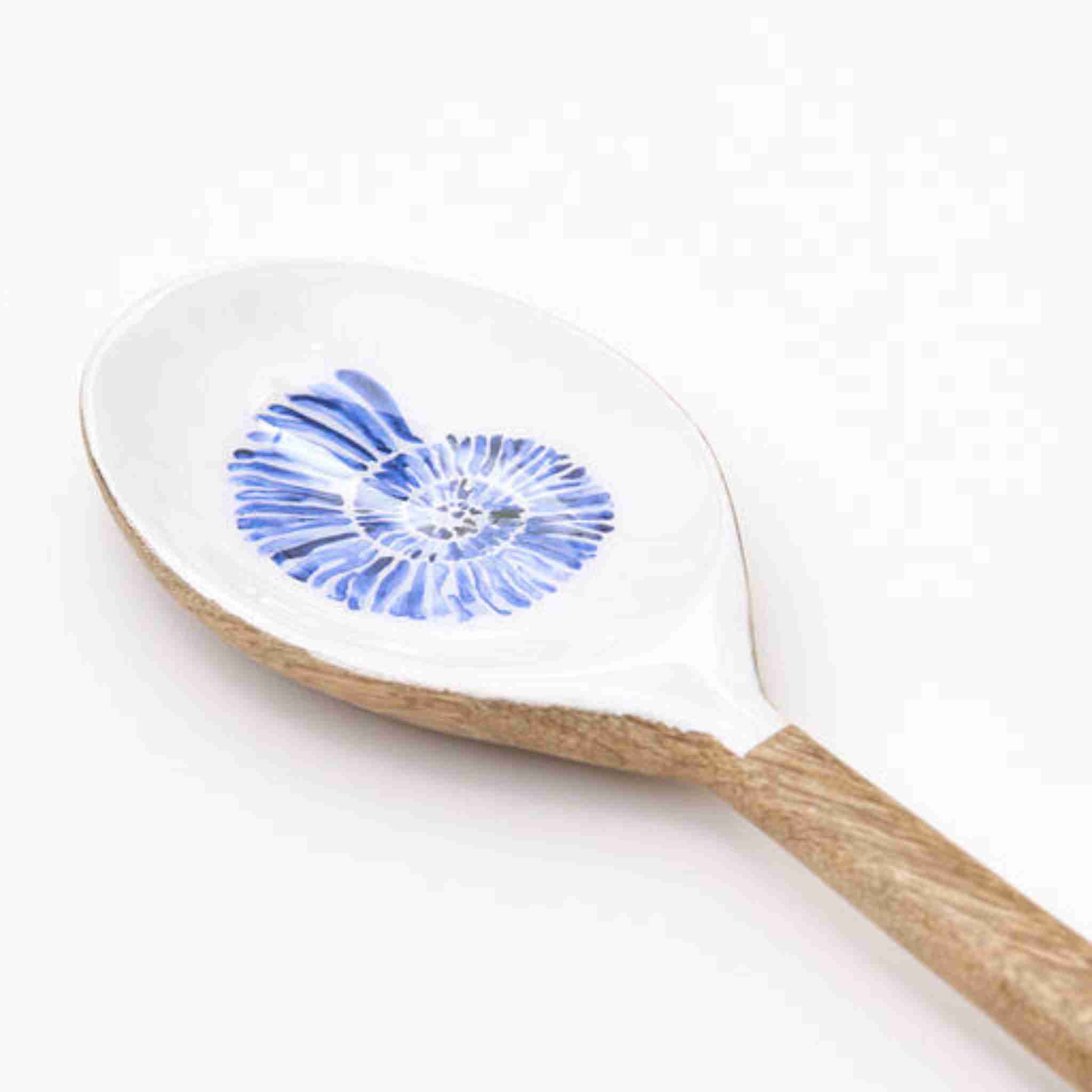Spoon with a blue shell design on a white background