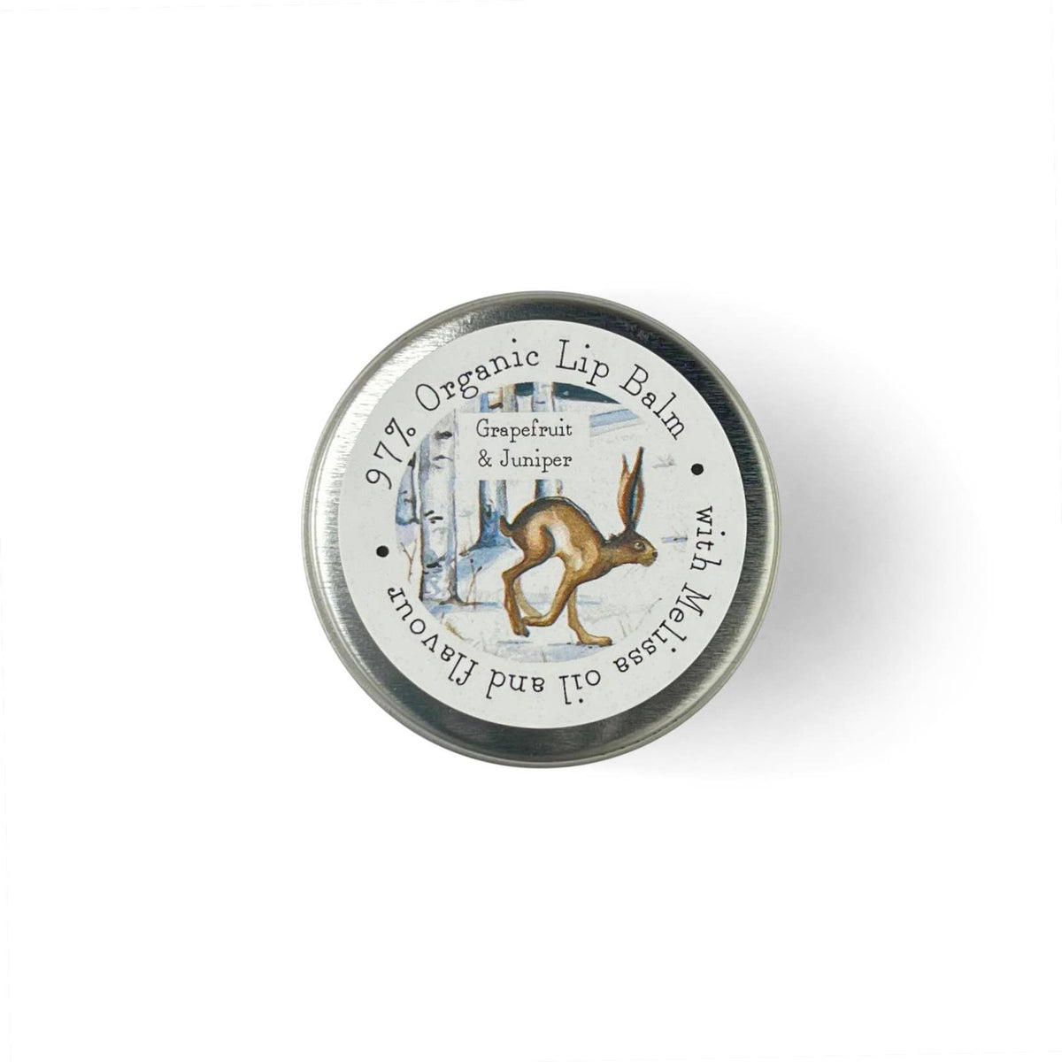 A round metal tin of organic lip balm with a white label featuring a brown hare illustration and text reading 'Grapefruit & Juniper' and 'with Melissa oil and flavour'.