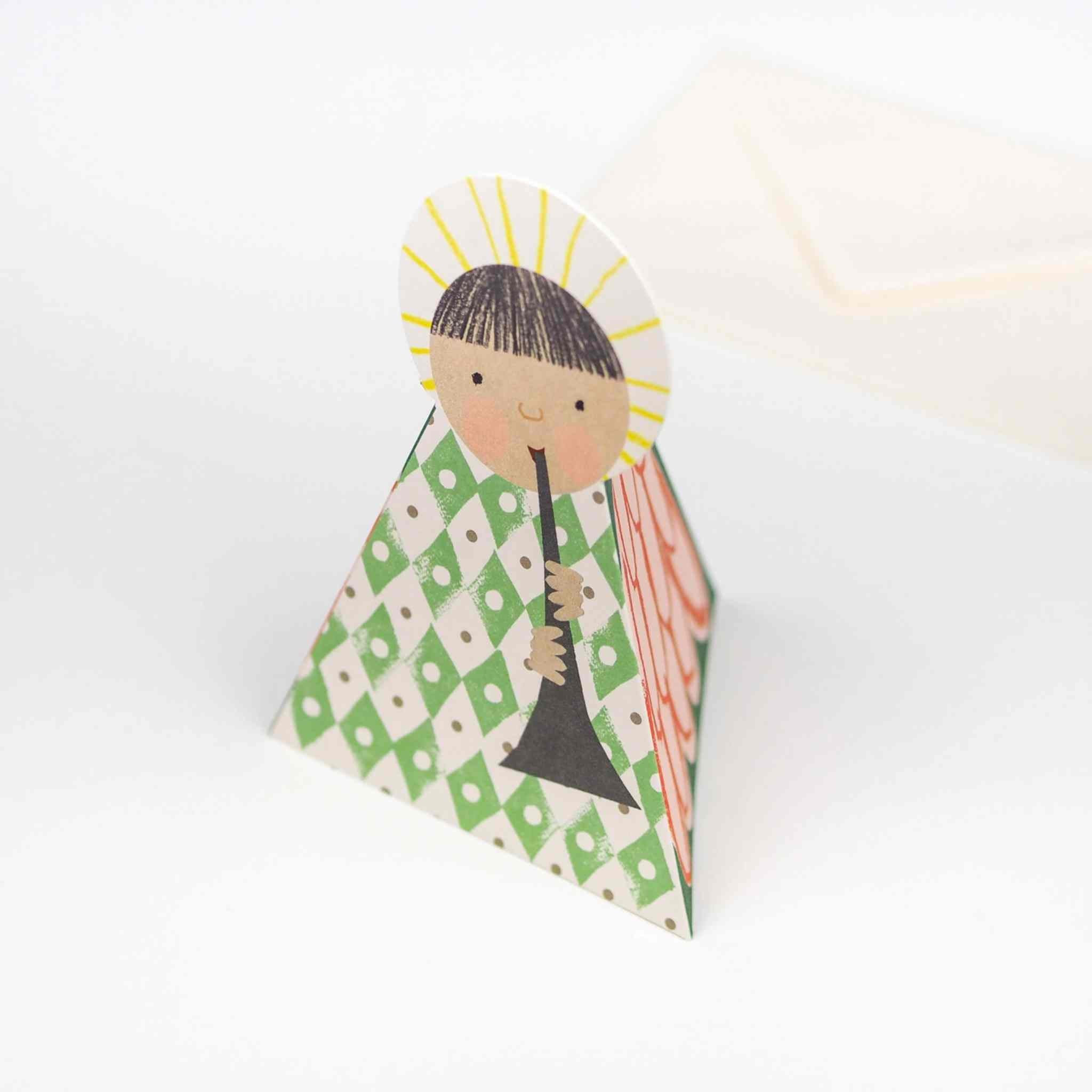 Decorative angel figure with green and white pattern on a white background