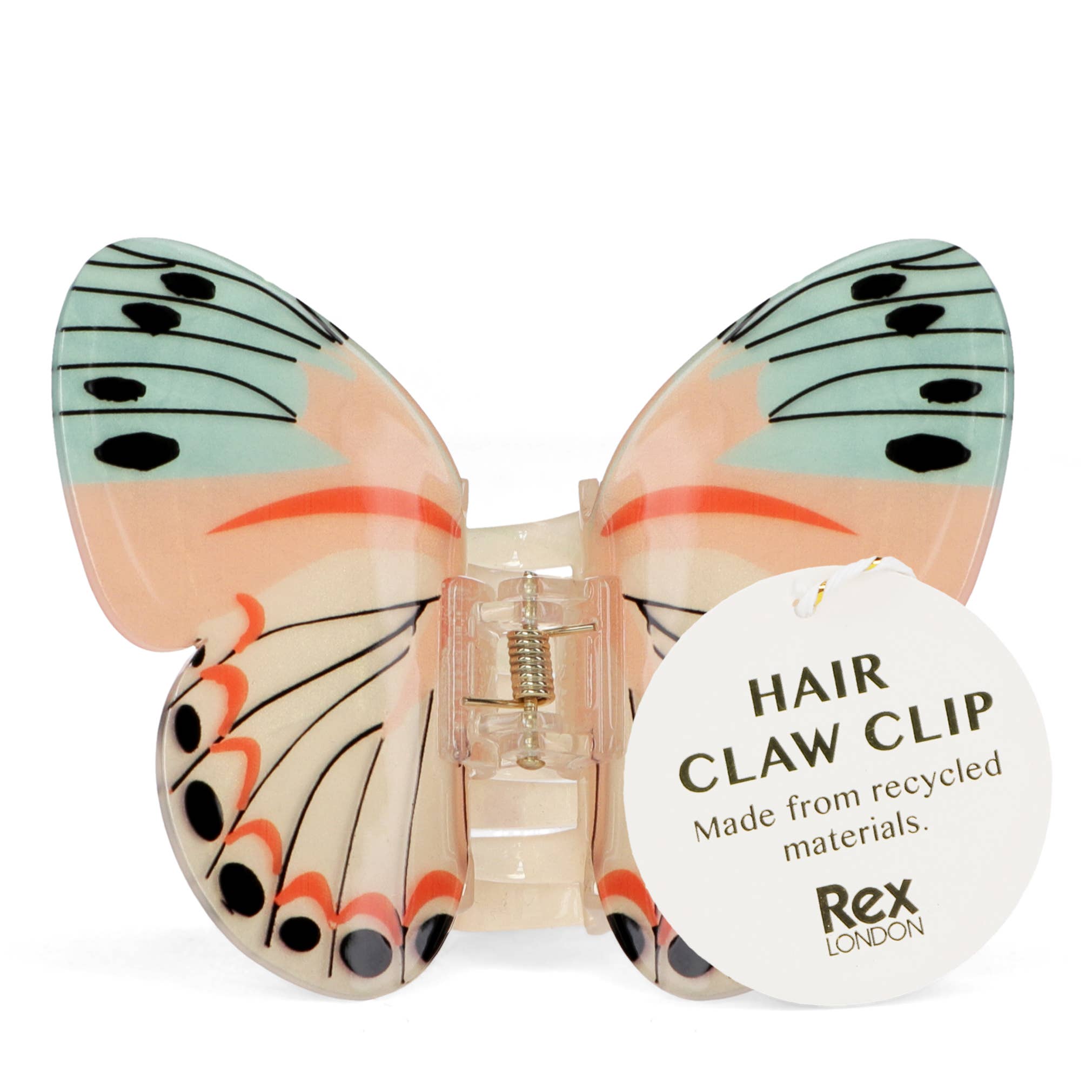 Butterfly-shaped hair claw clip with a label indicating recycled materials, brand 'Rex London' visible.