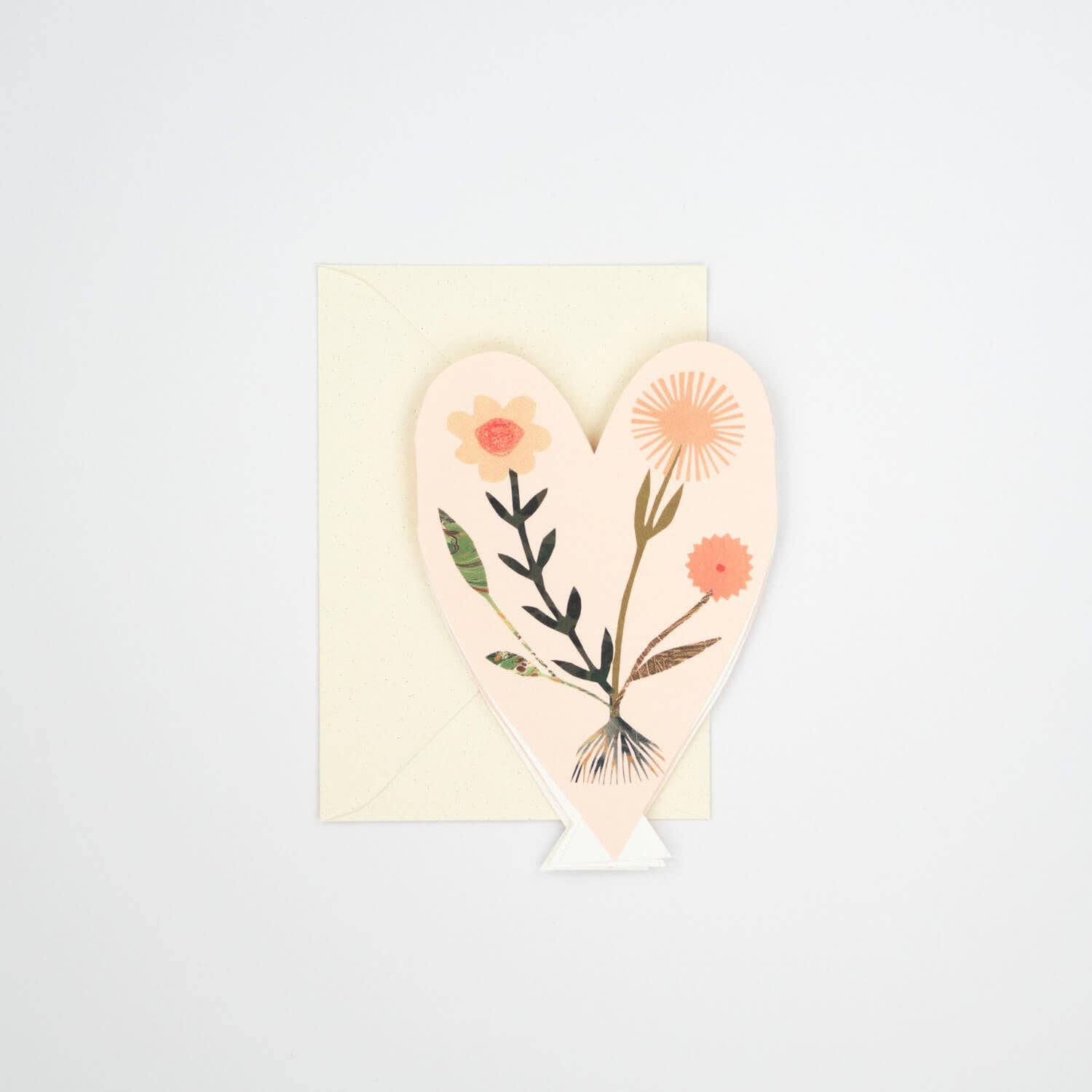 Heart-shaped card with floral design on a light gray background