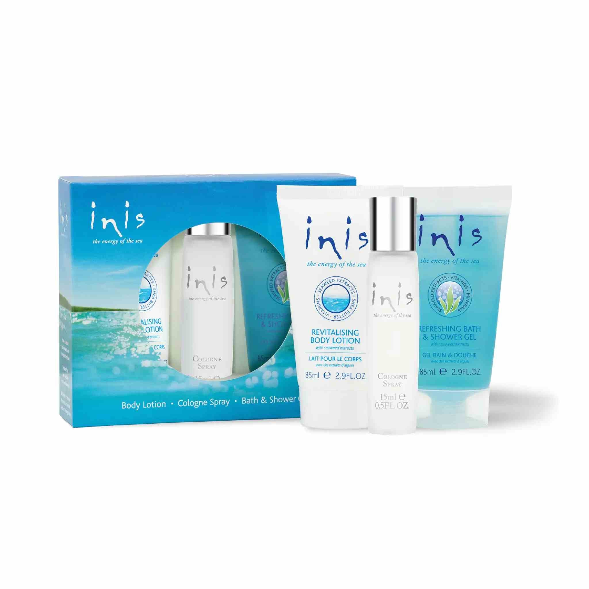 inis body care set including a blue gift box, body lotion tube, cologne spray bottle, and bath & shower gel tube on a white background.