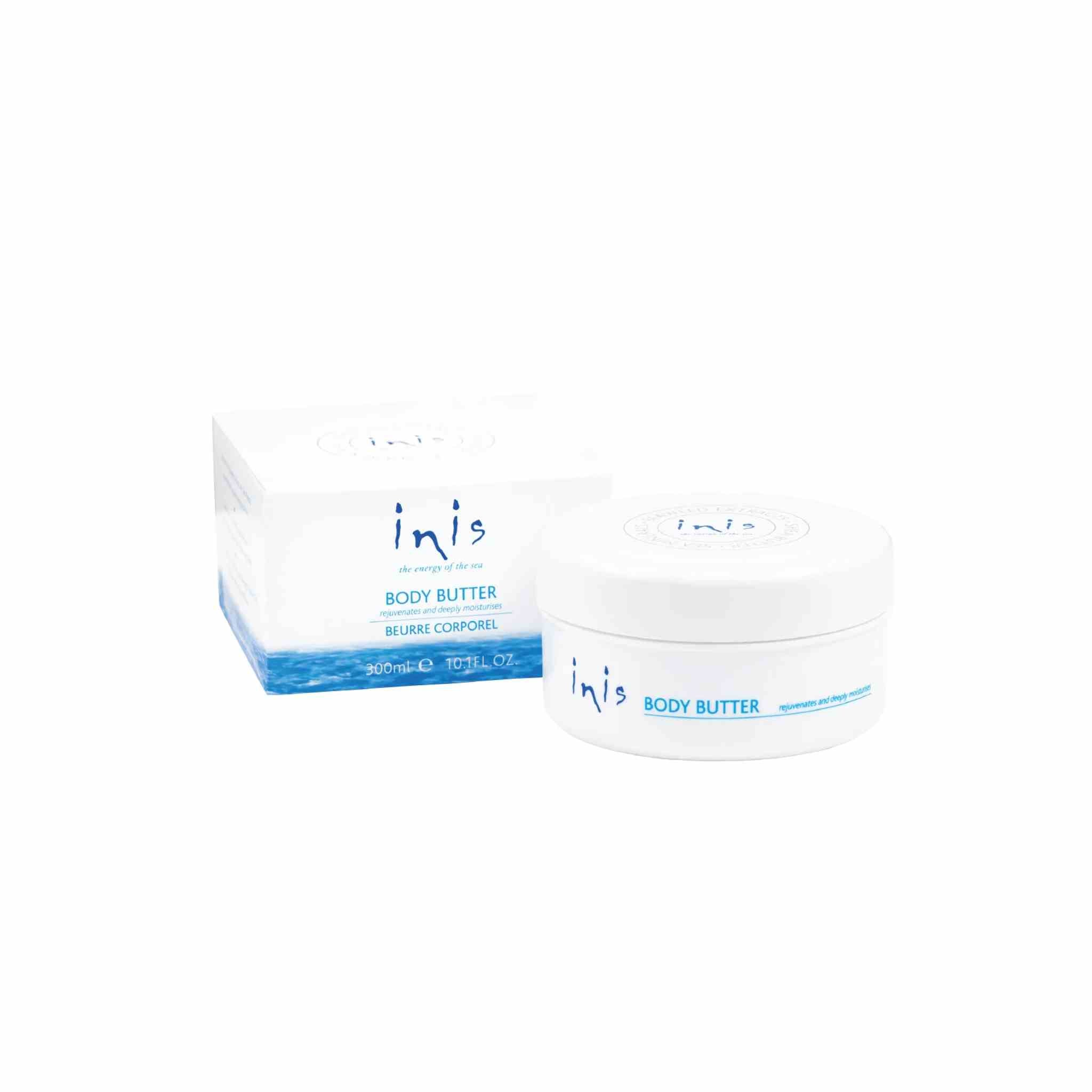 A white jar of inis Body Butter next to its white and blue packaging box on a plain white background.