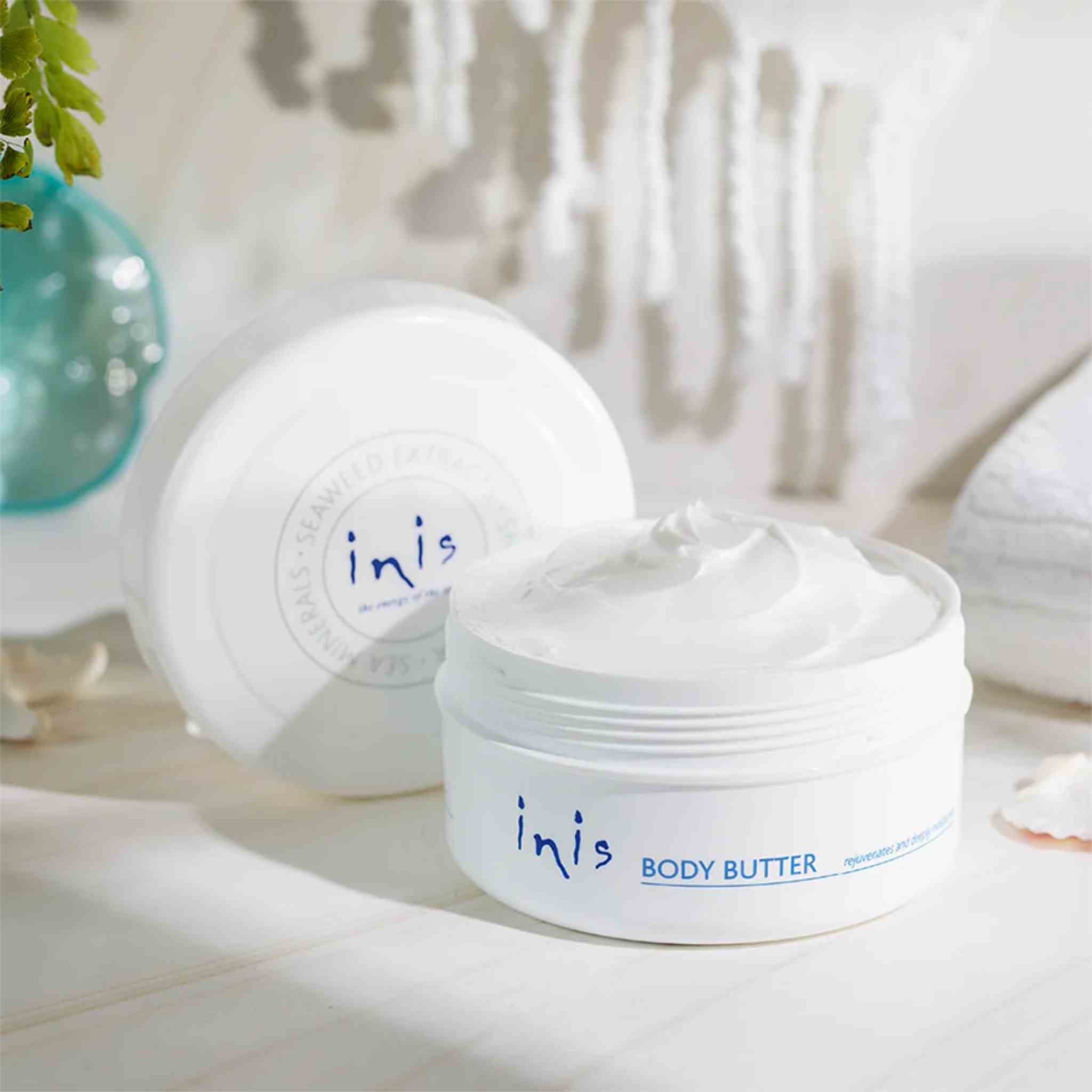 Inis body butter jar with a white background
