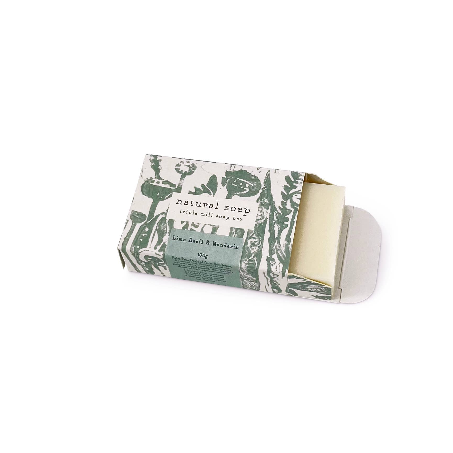 Bar of soap with a green and white decorative wrapper on a white background