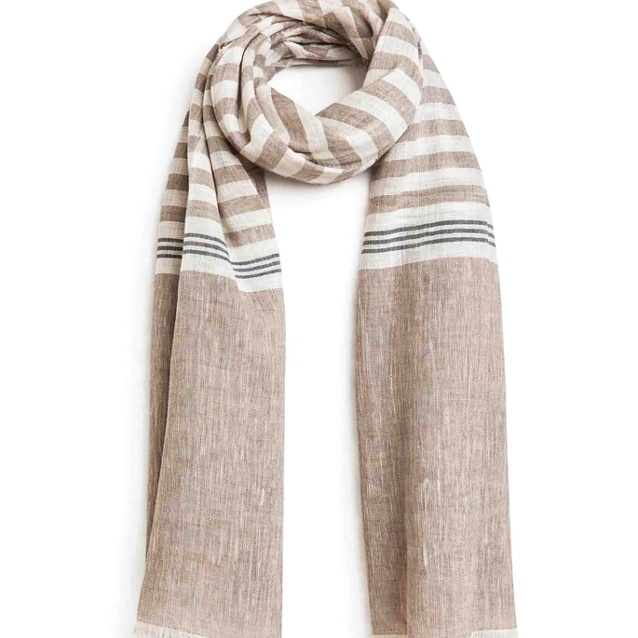 Striped scarf with beige and white pattern on a white background