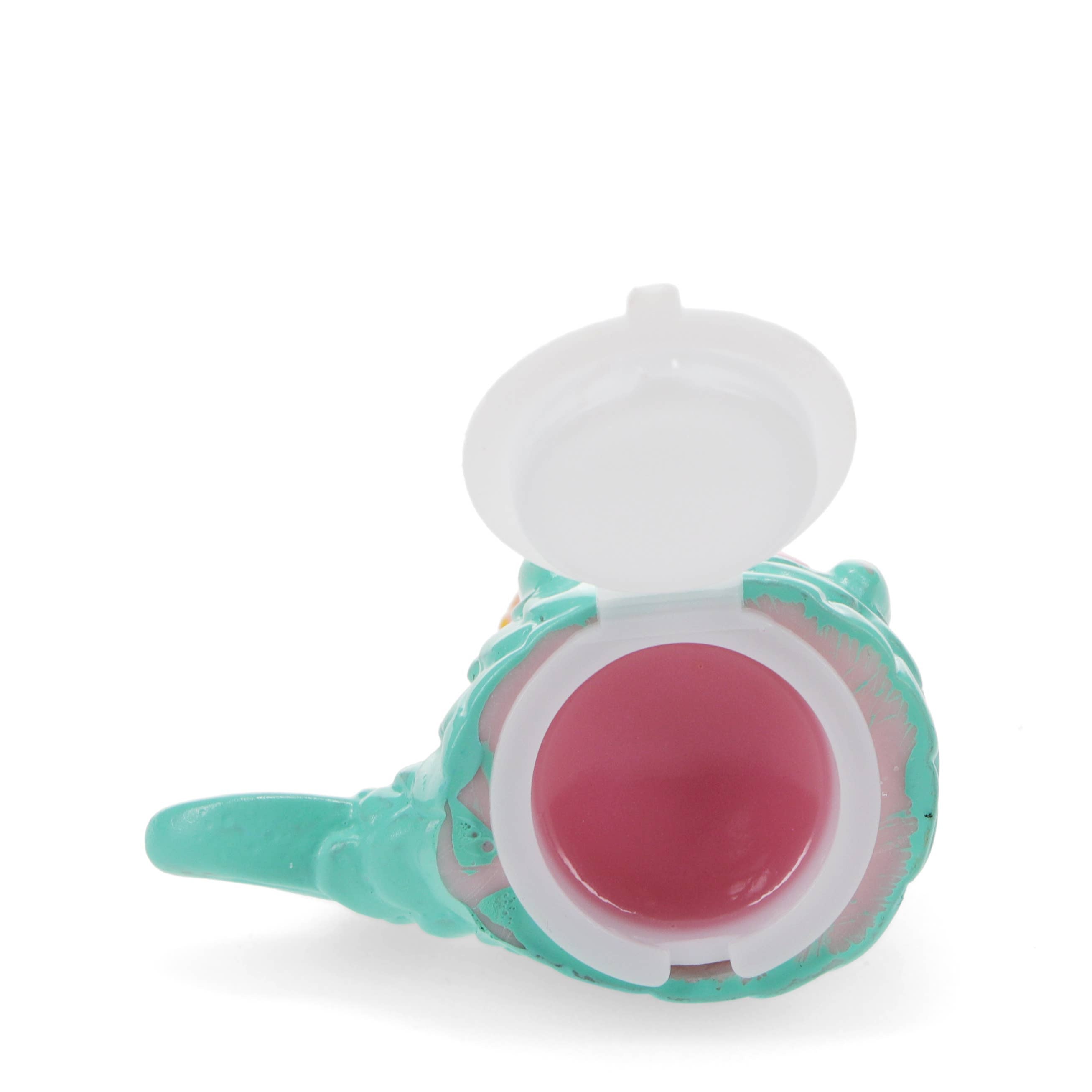 Pink lip balm in a teal container with a white lid on a white background