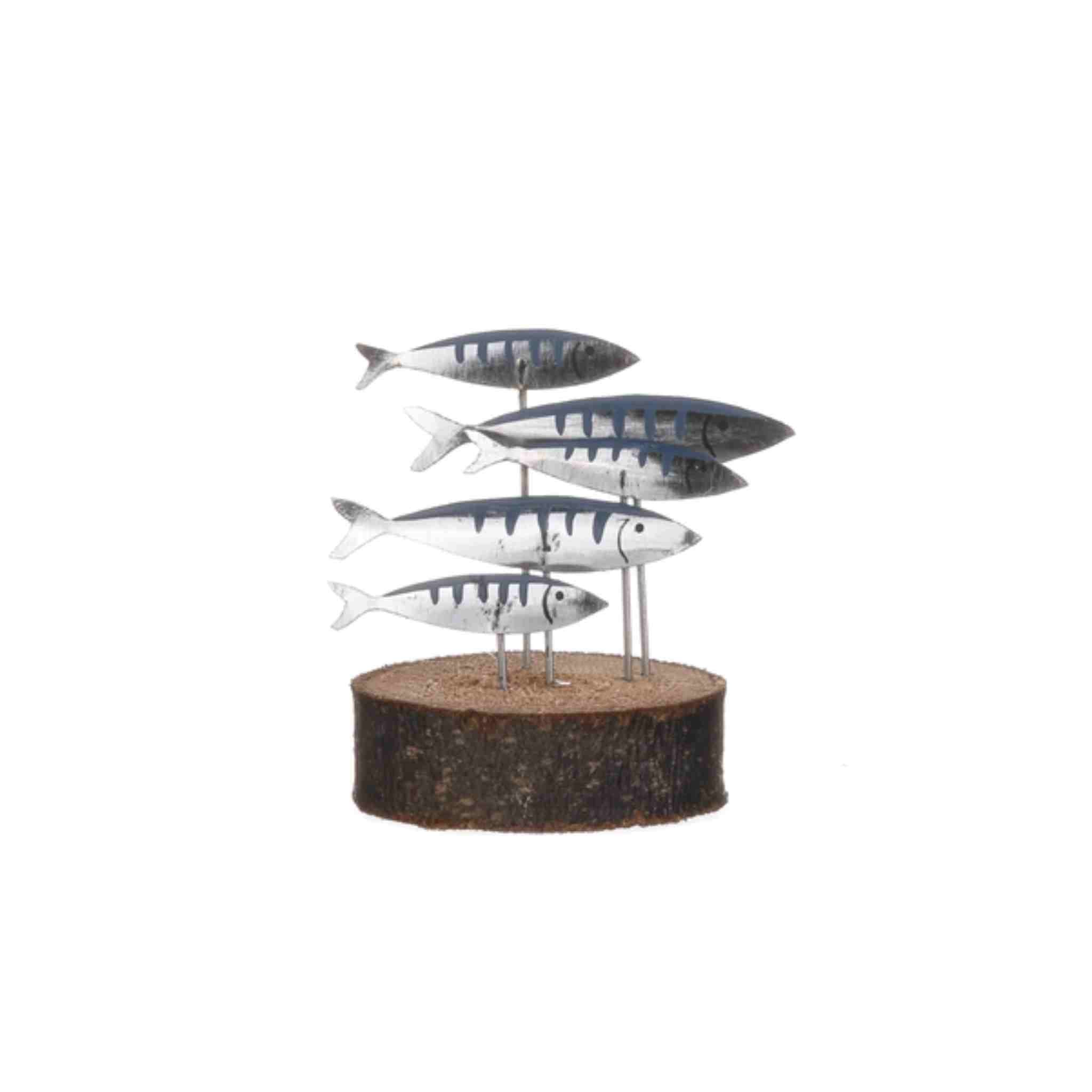 A decorative metal sculpture of five fish mounted on a round bark base, photographed against a plain white background.