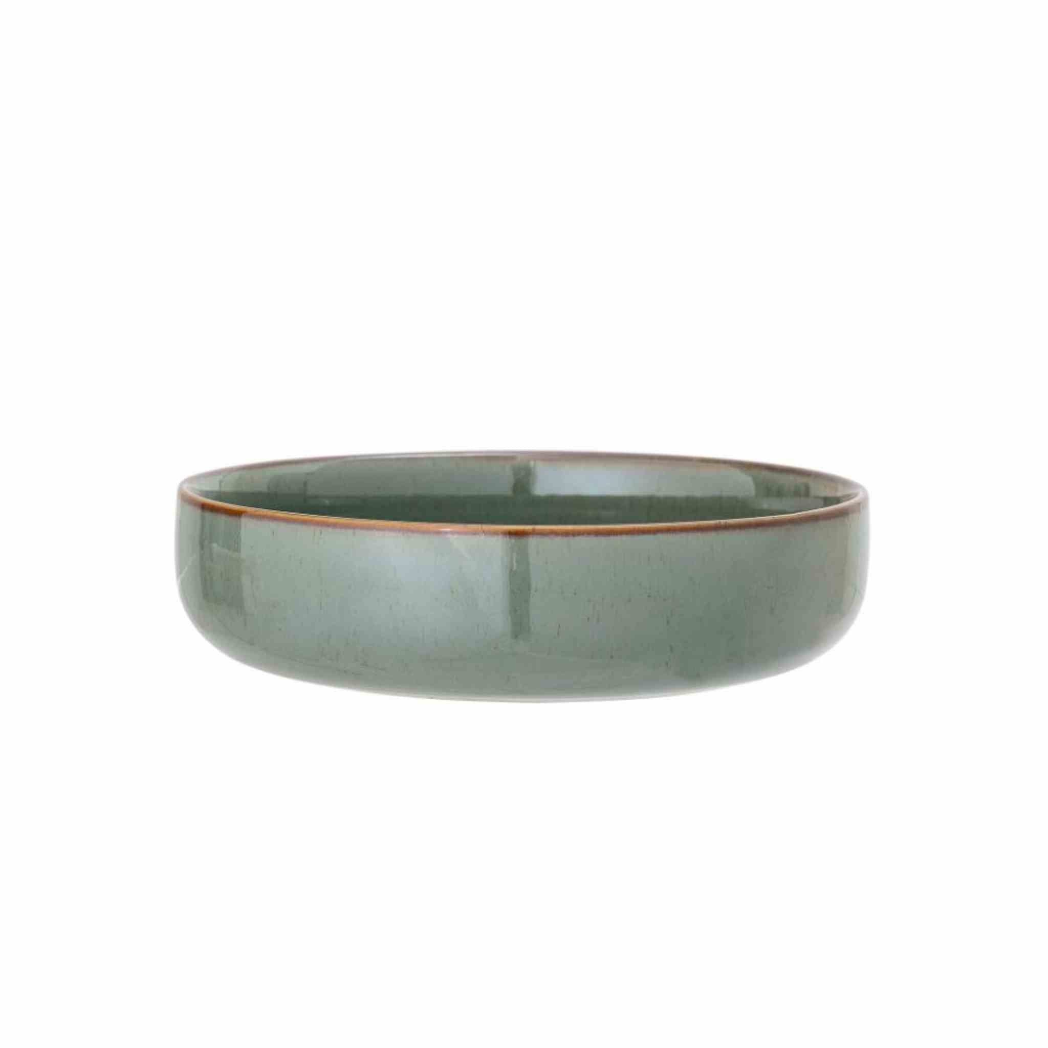 Green ceramic bowl on a white background