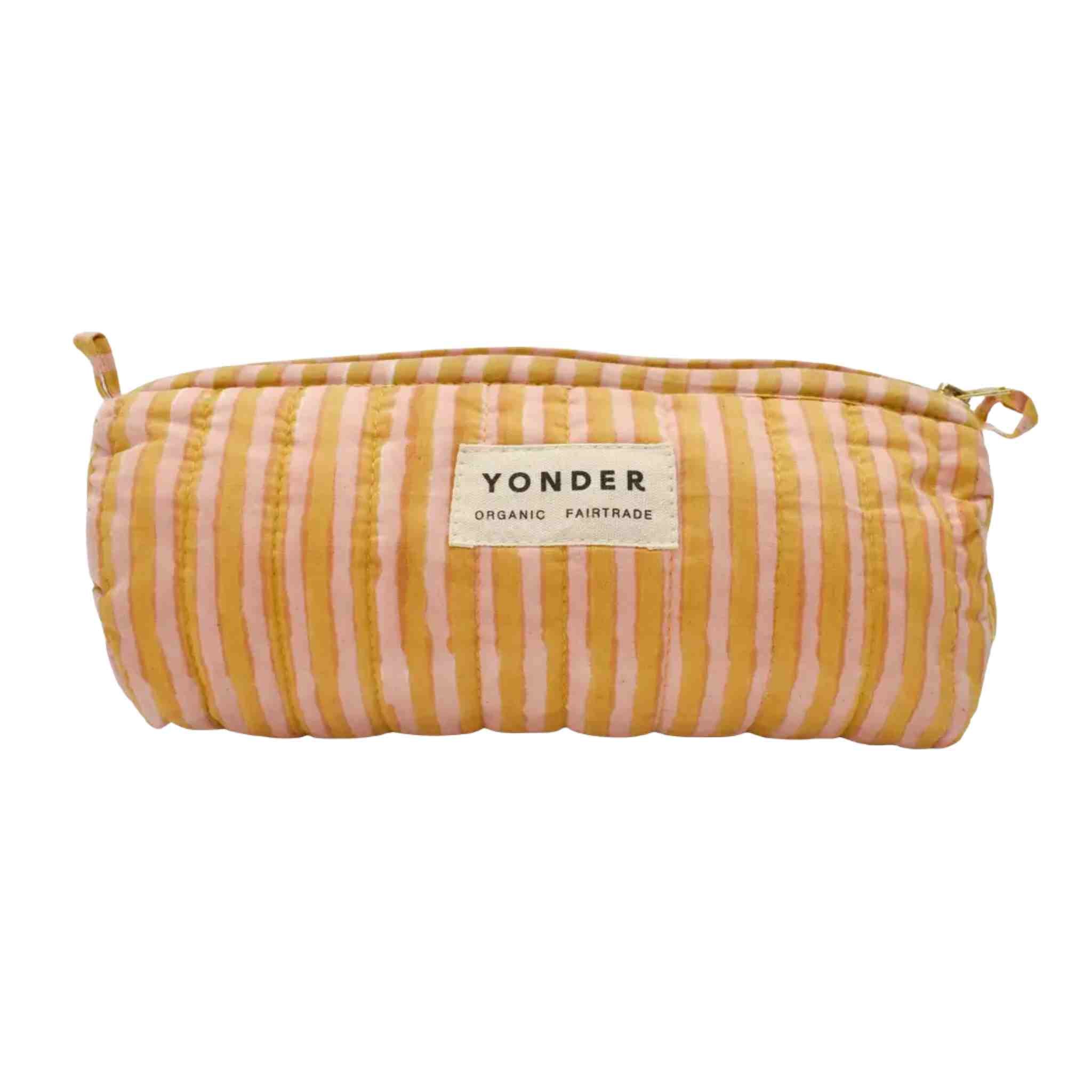 A Yonder Organic Fairtrade zippered pouch with vertical stripes in mustard yellow and light pink, featuring a white brand label on the front.
