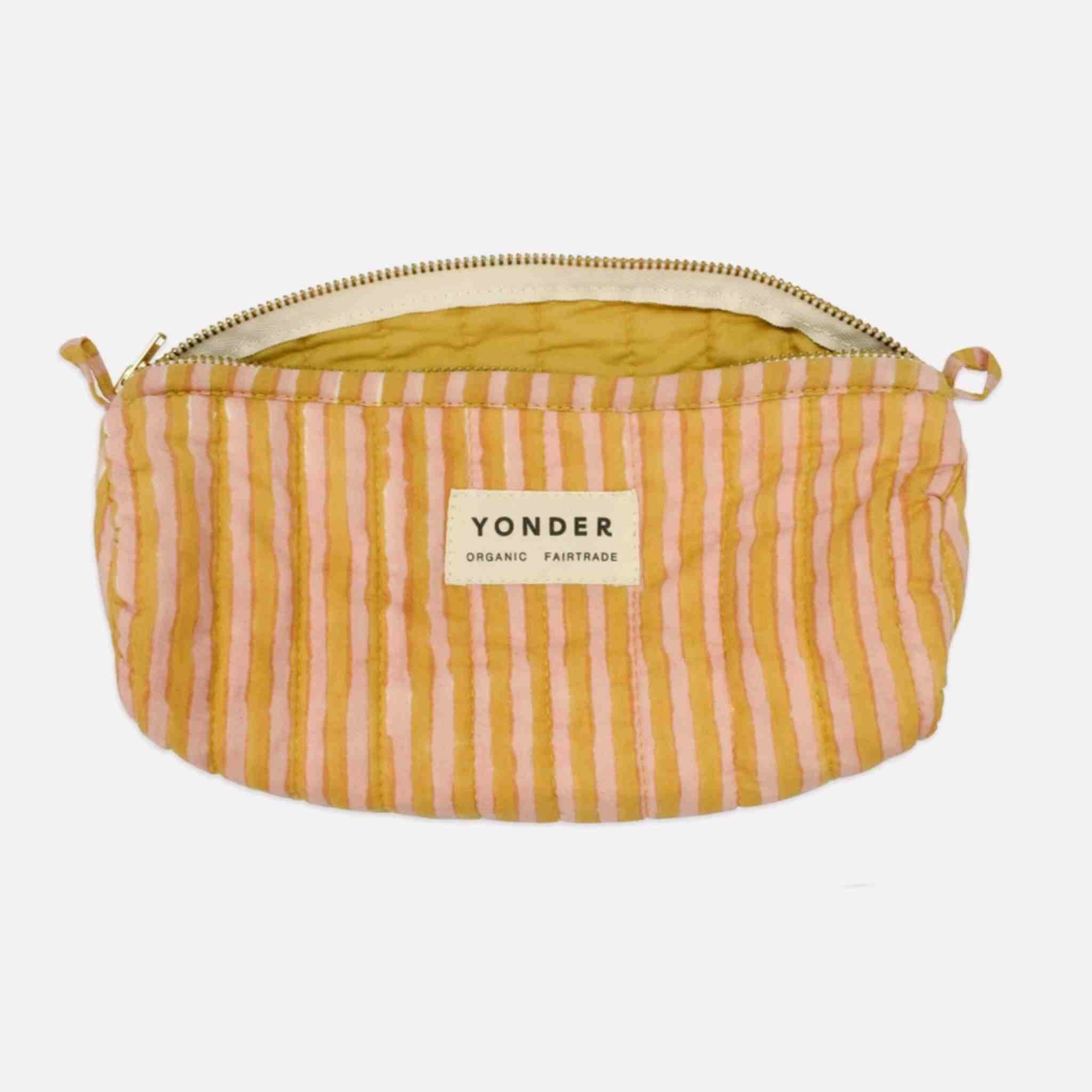 Striped pouch with 'Yonder' branding on a white background