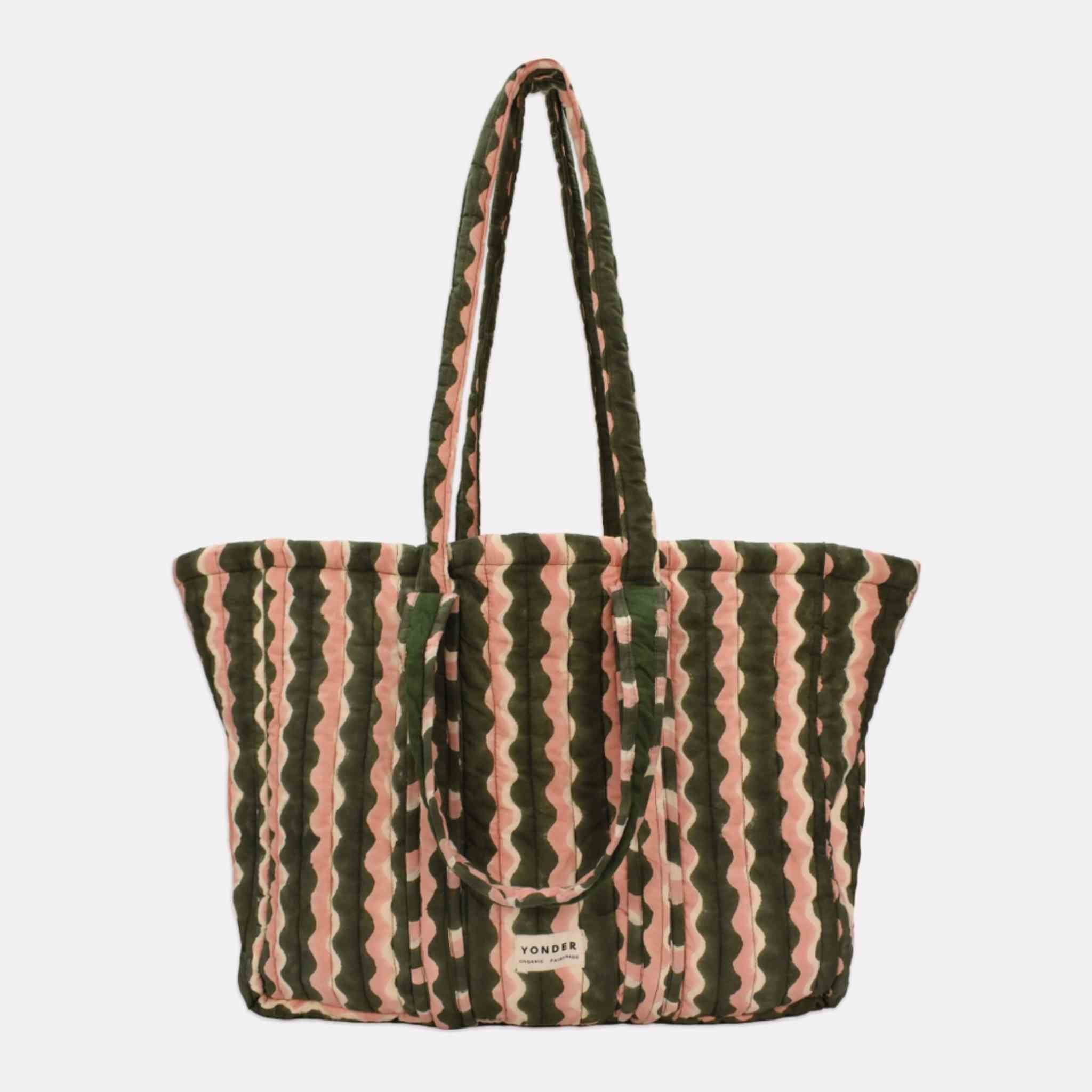 A large tote bag with vertical wavy stripes in dark olive green and dusty pink, featuring dual shoulder straps.