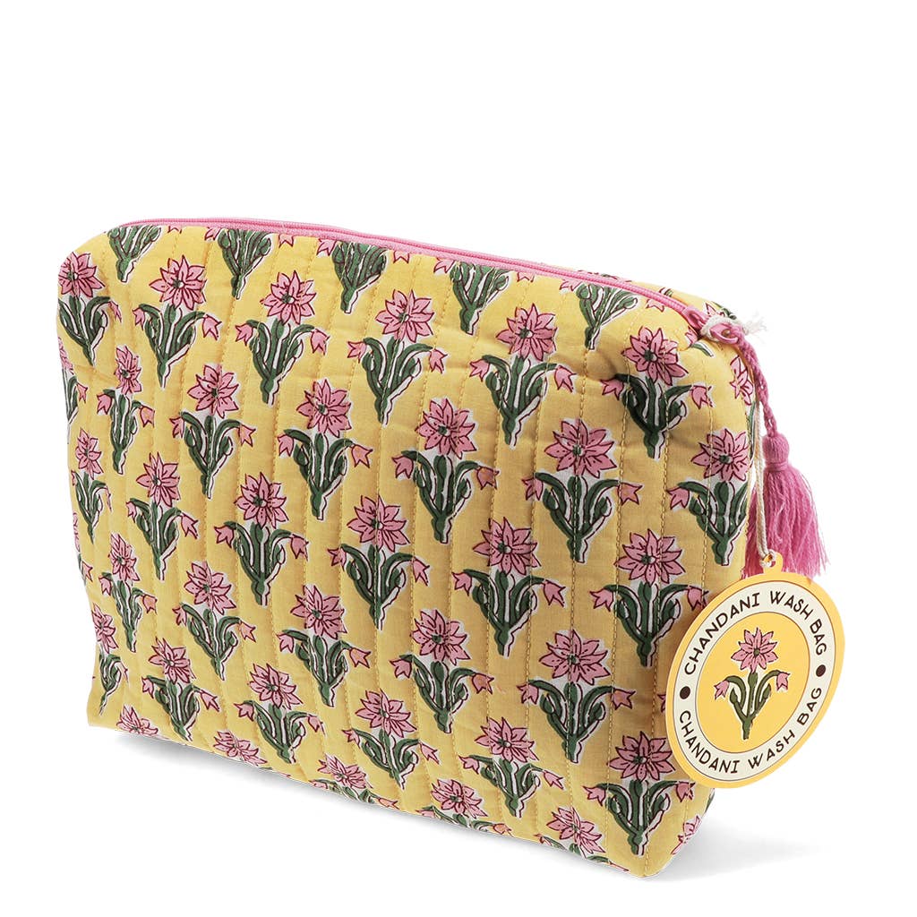 Floral patterned wash bag with a visible brand label on a white background