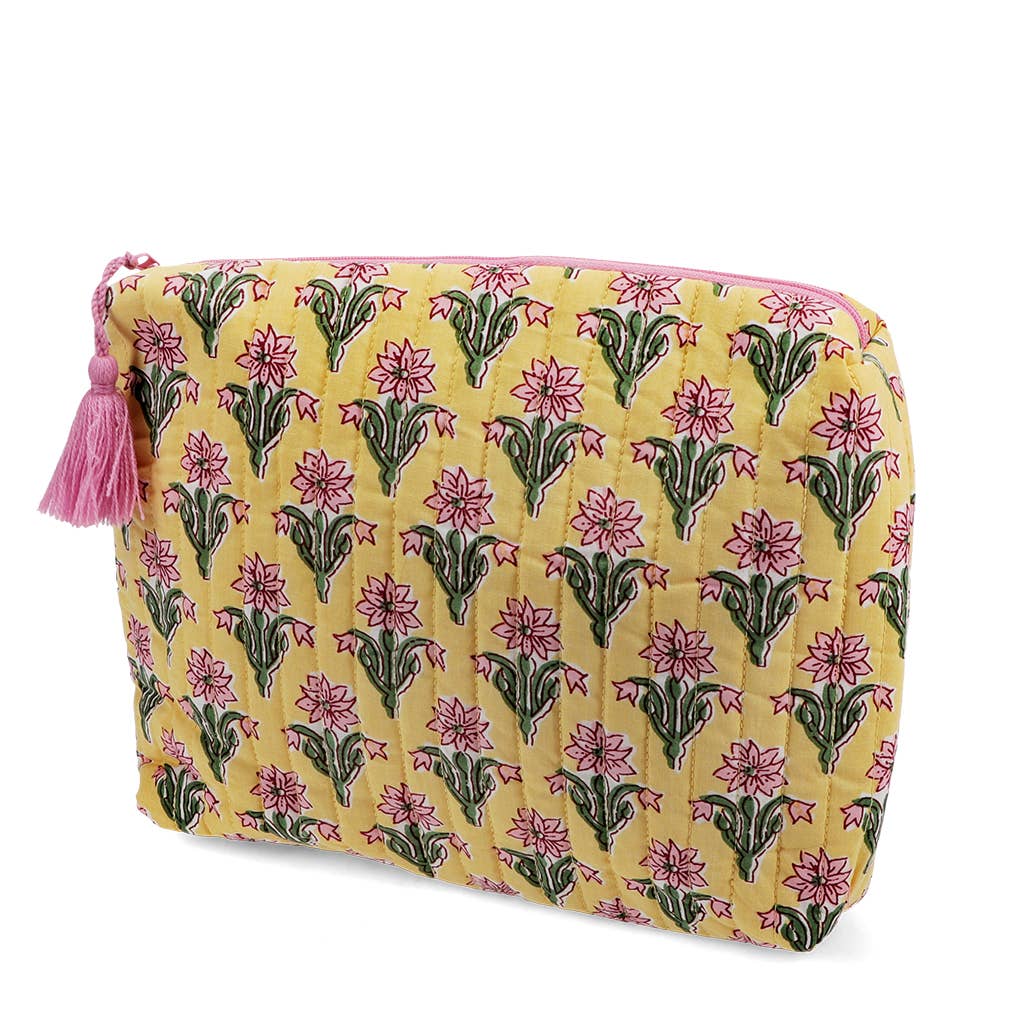Floral patterned pouch with pink tassel on a white background