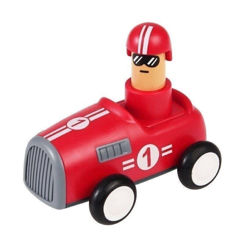 Toy figure of a race car driver in a red car with a white number 1 on a white background