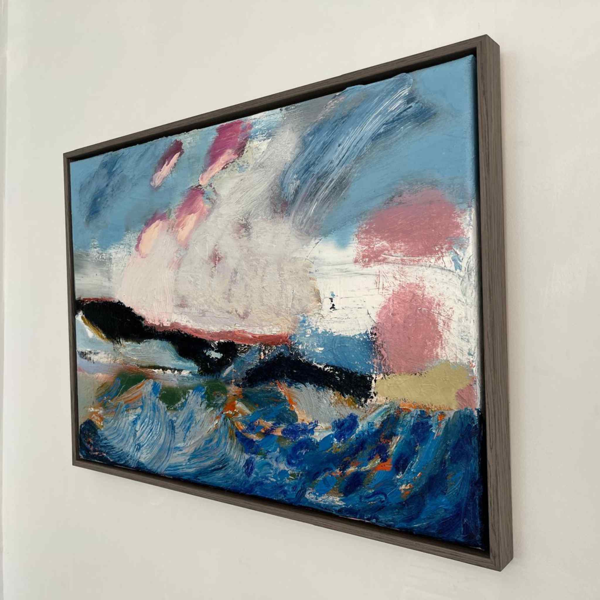 Abstract painting with colorful brush strokes on a white wall