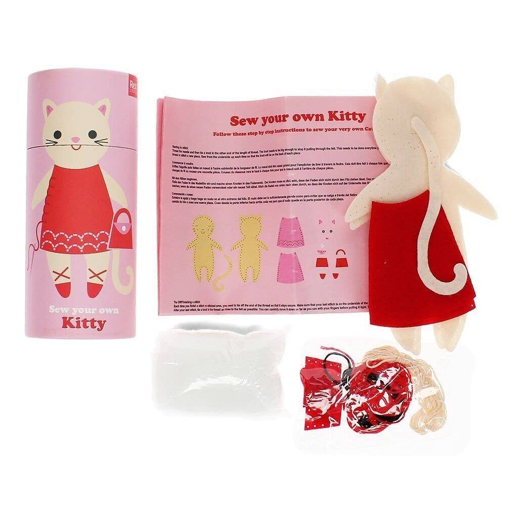 Sew your own kitty craft kit with cat-shaped fabric, pink packaging, and instructions on a white background.
