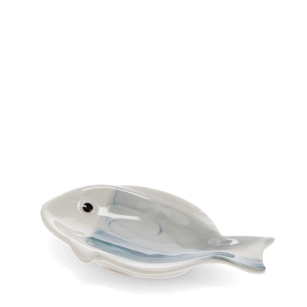 Fish-shaped ceramic dish on a white background