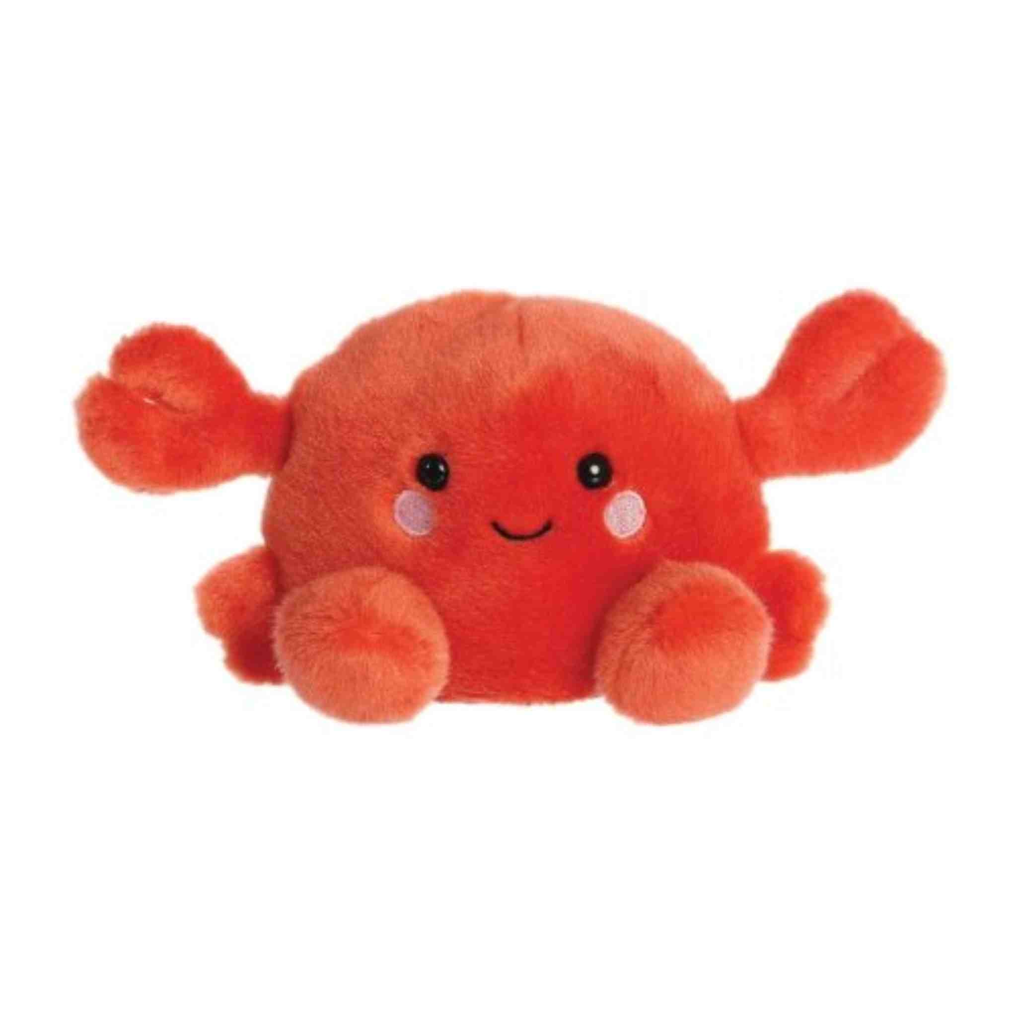 Plush crab toy with a smiling face on a white background