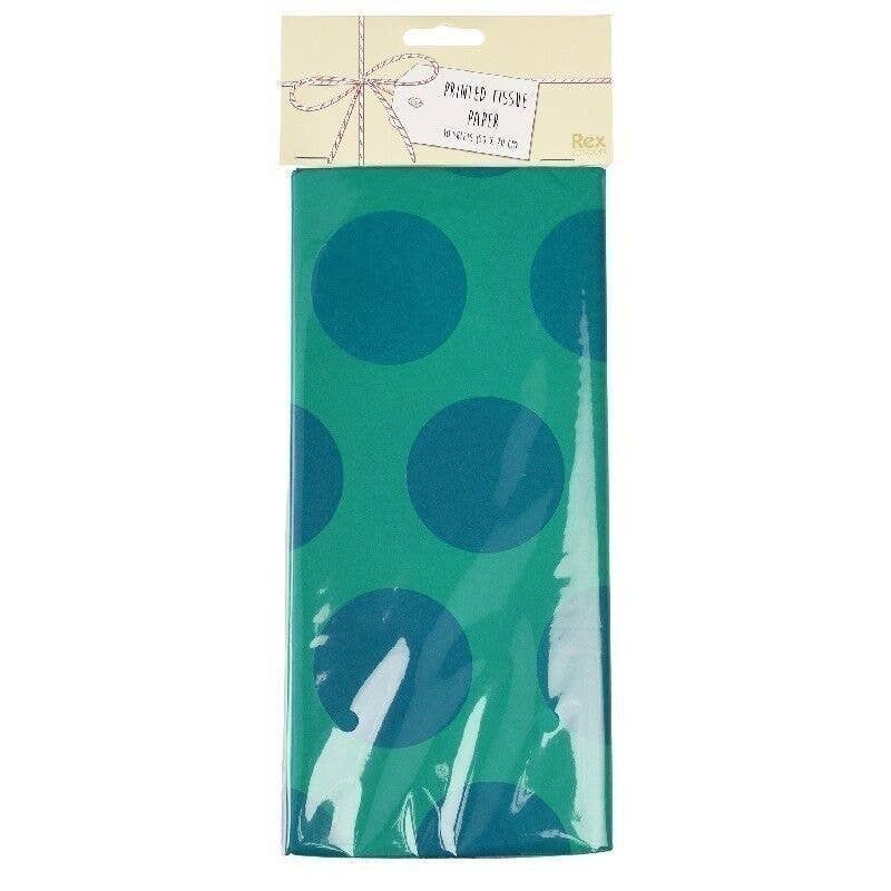 Packaged green paper with blue polka dots on a white background