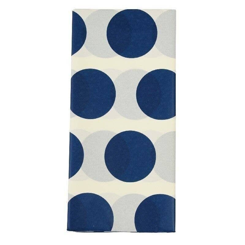 Rectangular folded paper with navy circular pattern on a white background